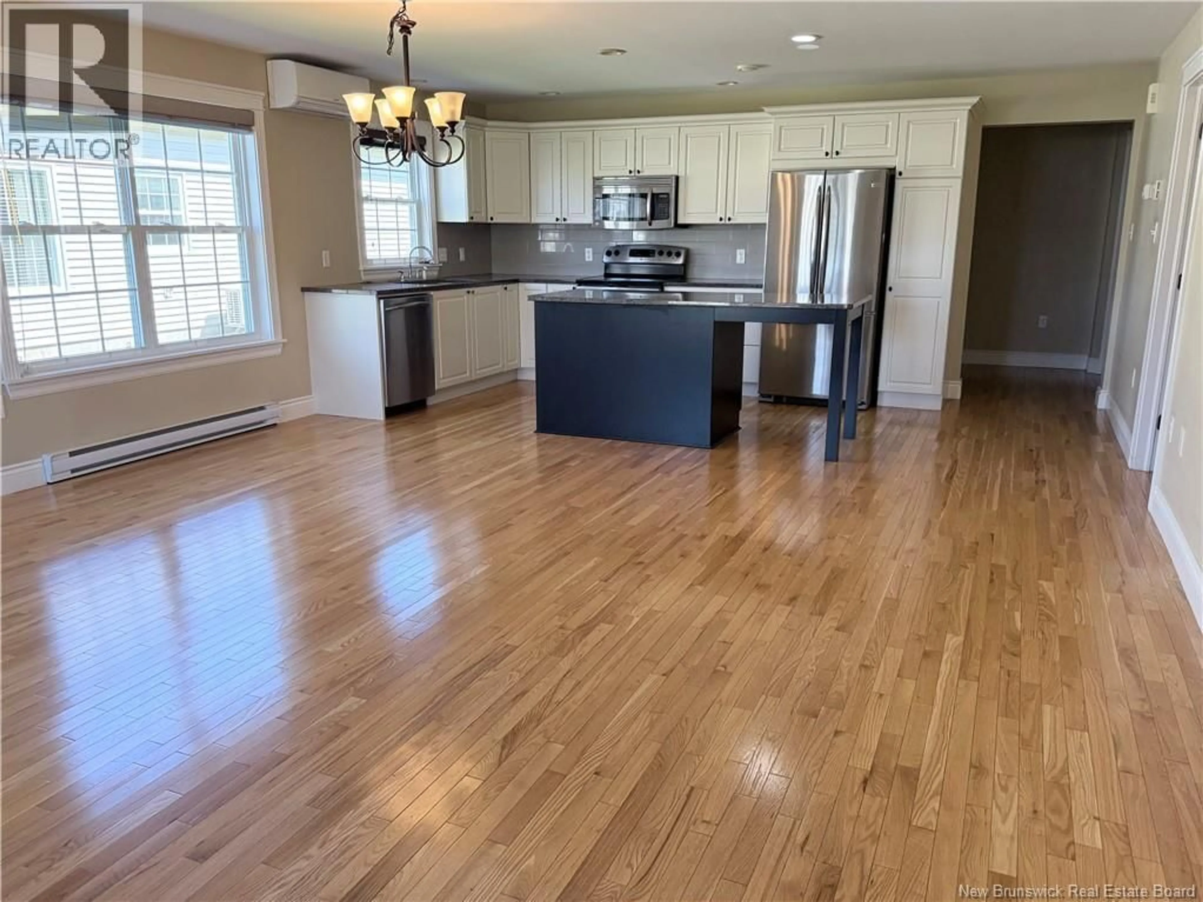 Open concept kitchen, wood/laminate floor for 21 MEADOW LANE, Sussex New Brunswick E4E1M0