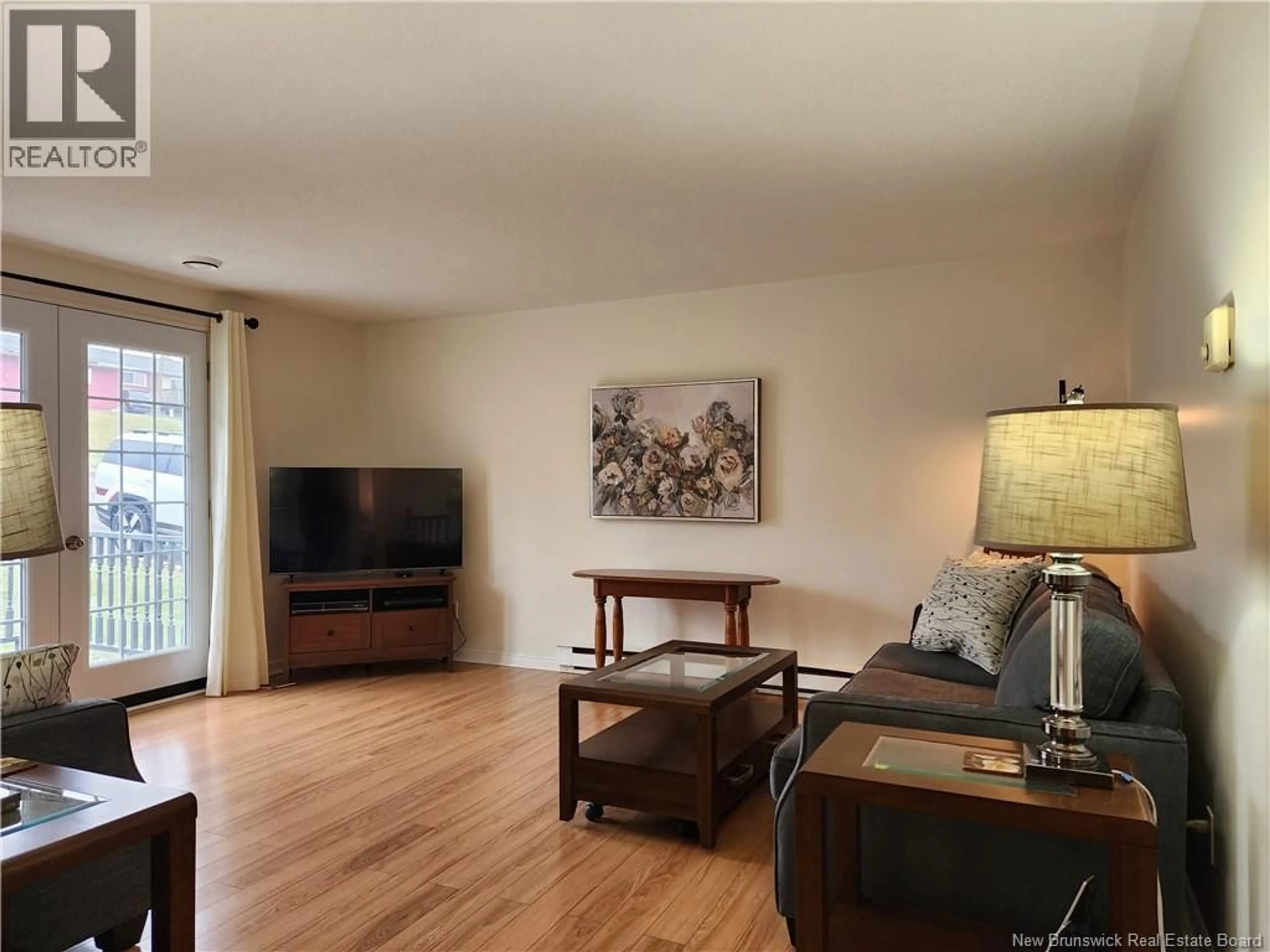 Living room with furniture, wood/laminate floor for 26 LONGVIEW COURT, Saint John New Brunswick E2J4N2