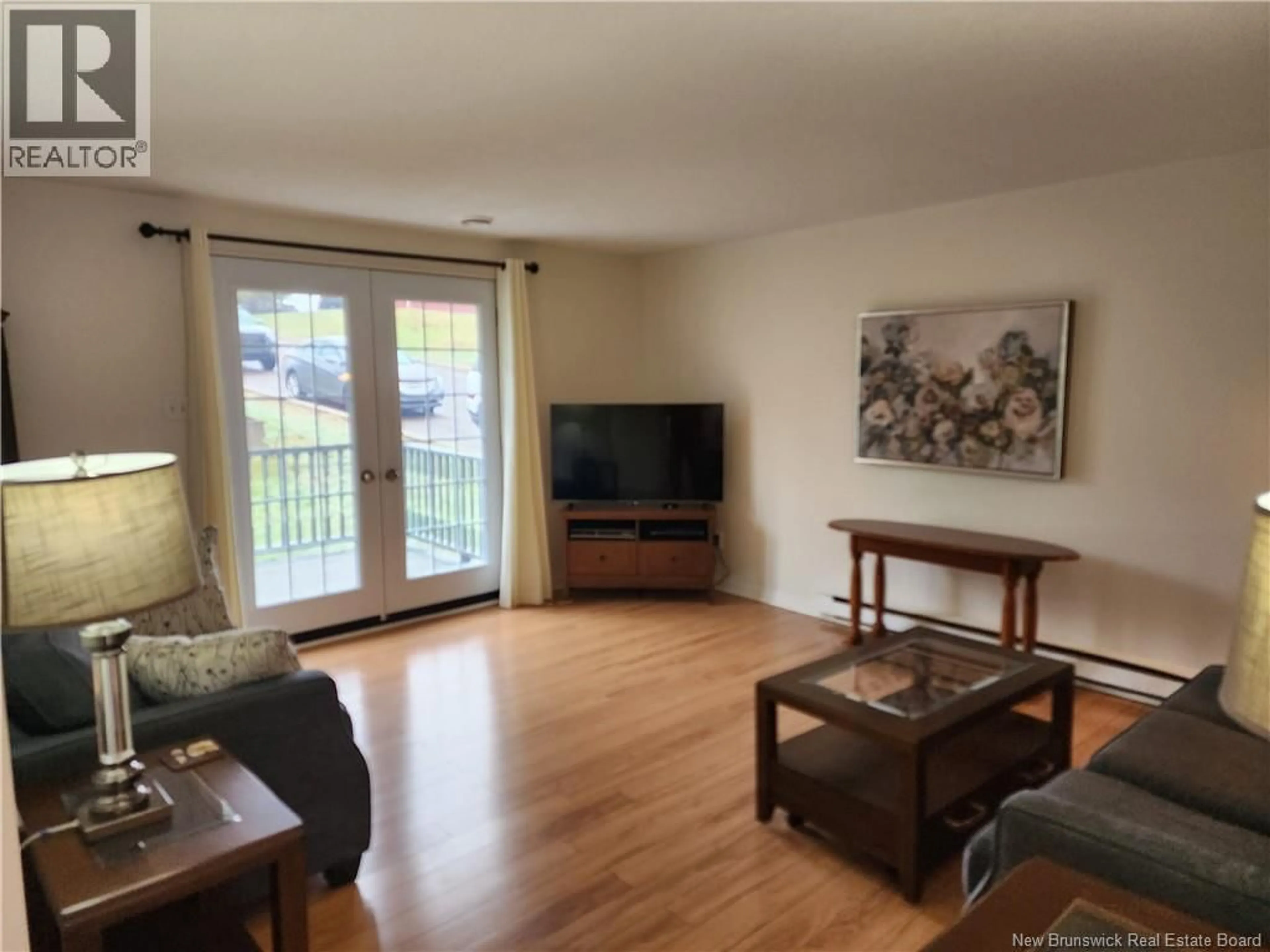 Living room with furniture, wood/laminate floor for 26 LONGVIEW COURT, Saint John New Brunswick E2J4N2