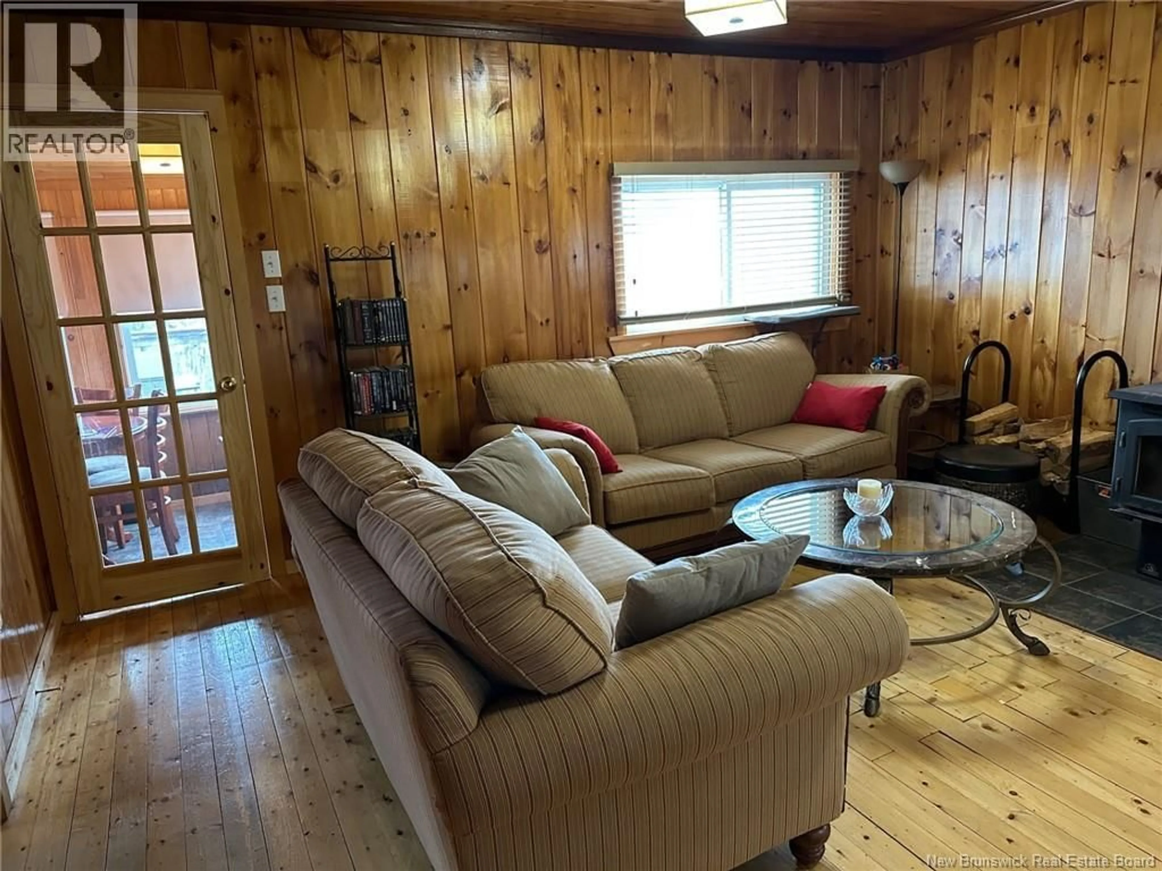 Living room with furniture, wood/laminate floor for 114 MCNAMEE ROAD, McNamee New Brunswick E9C2G6