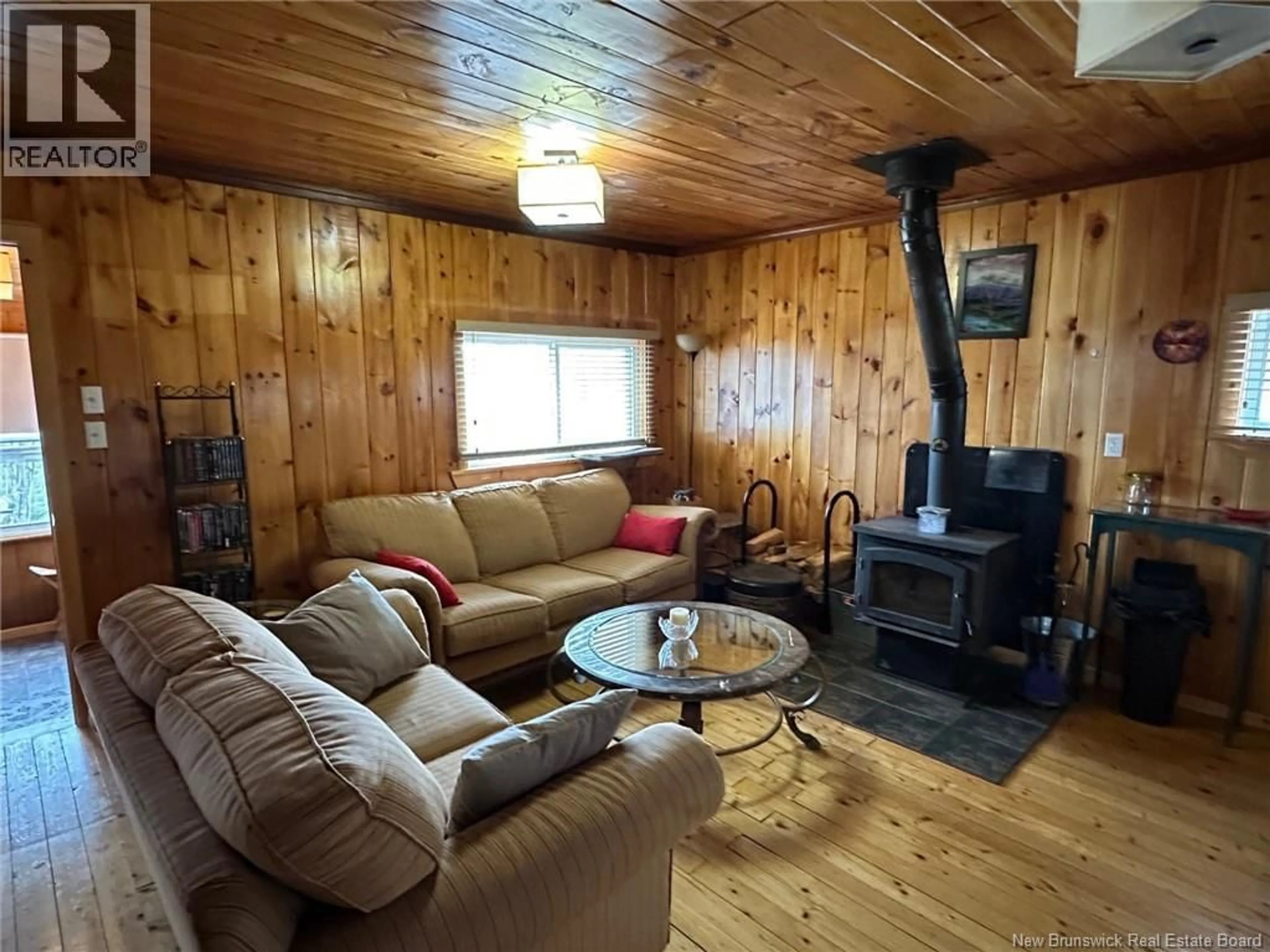 Living room with furniture, wood/laminate floor for 114 MCNAMEE ROAD, McNamee New Brunswick E9C2G6