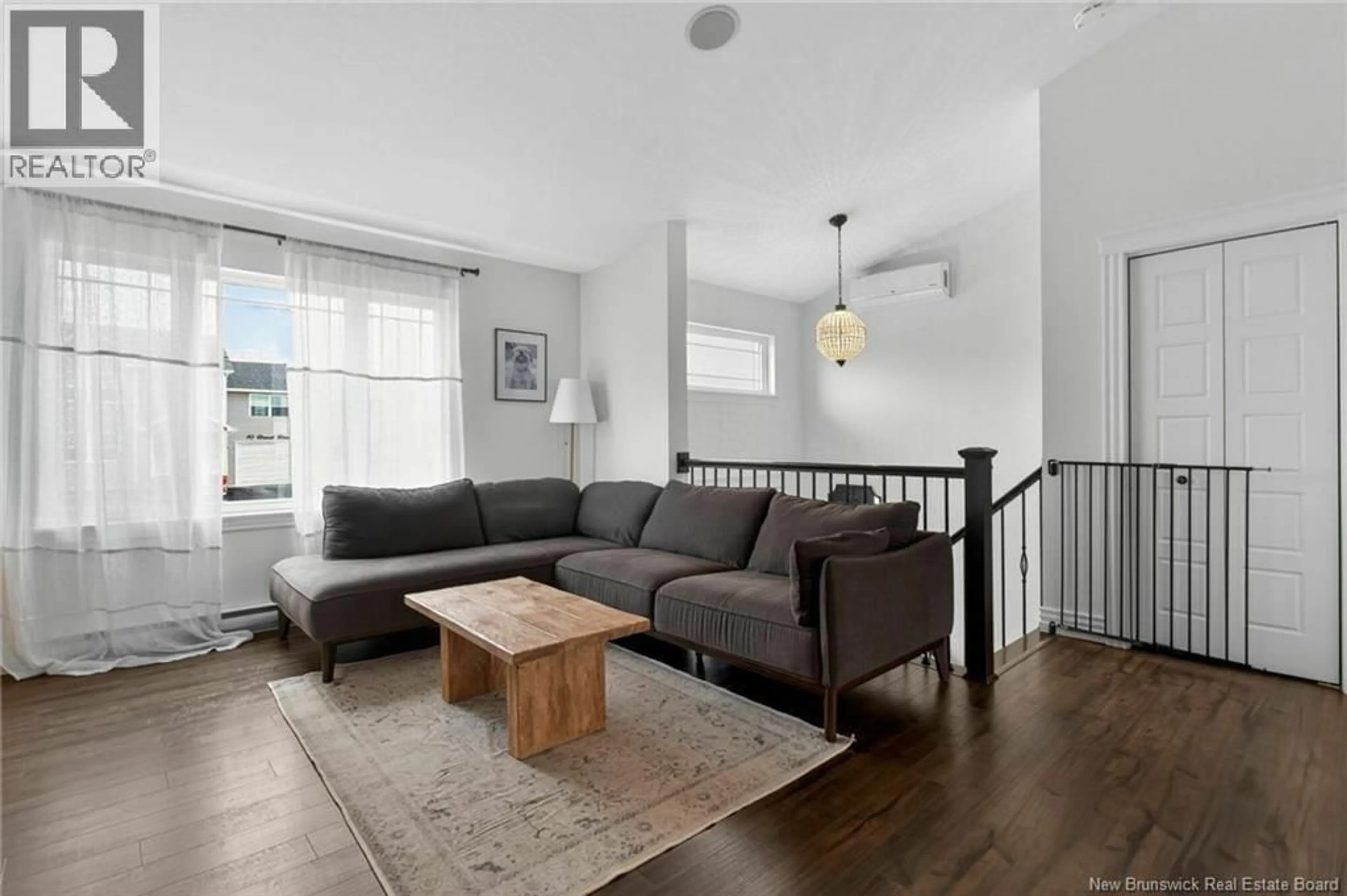 Living room with furniture, unknown for 65 BREVET STREET, Moncton New Brunswick E1G5S5