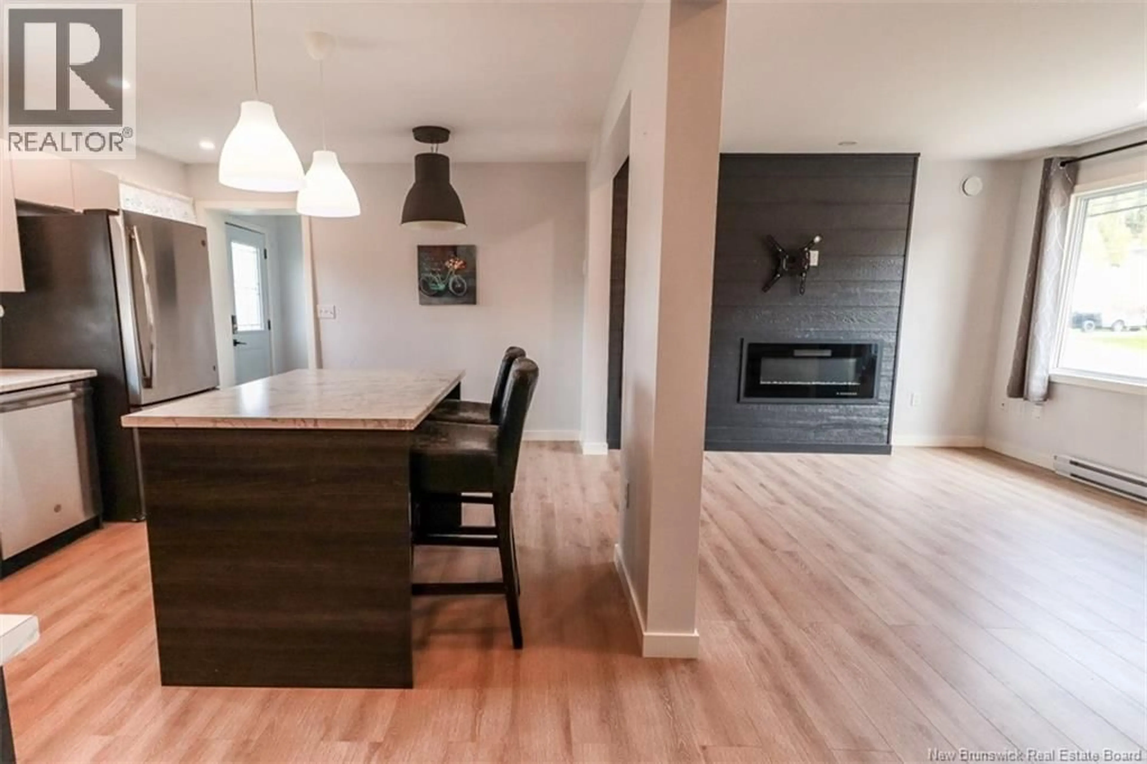 Open concept kitchen, wood/laminate floor for 70 GLEN ROAD, Saint John New Brunswick E2H2E1