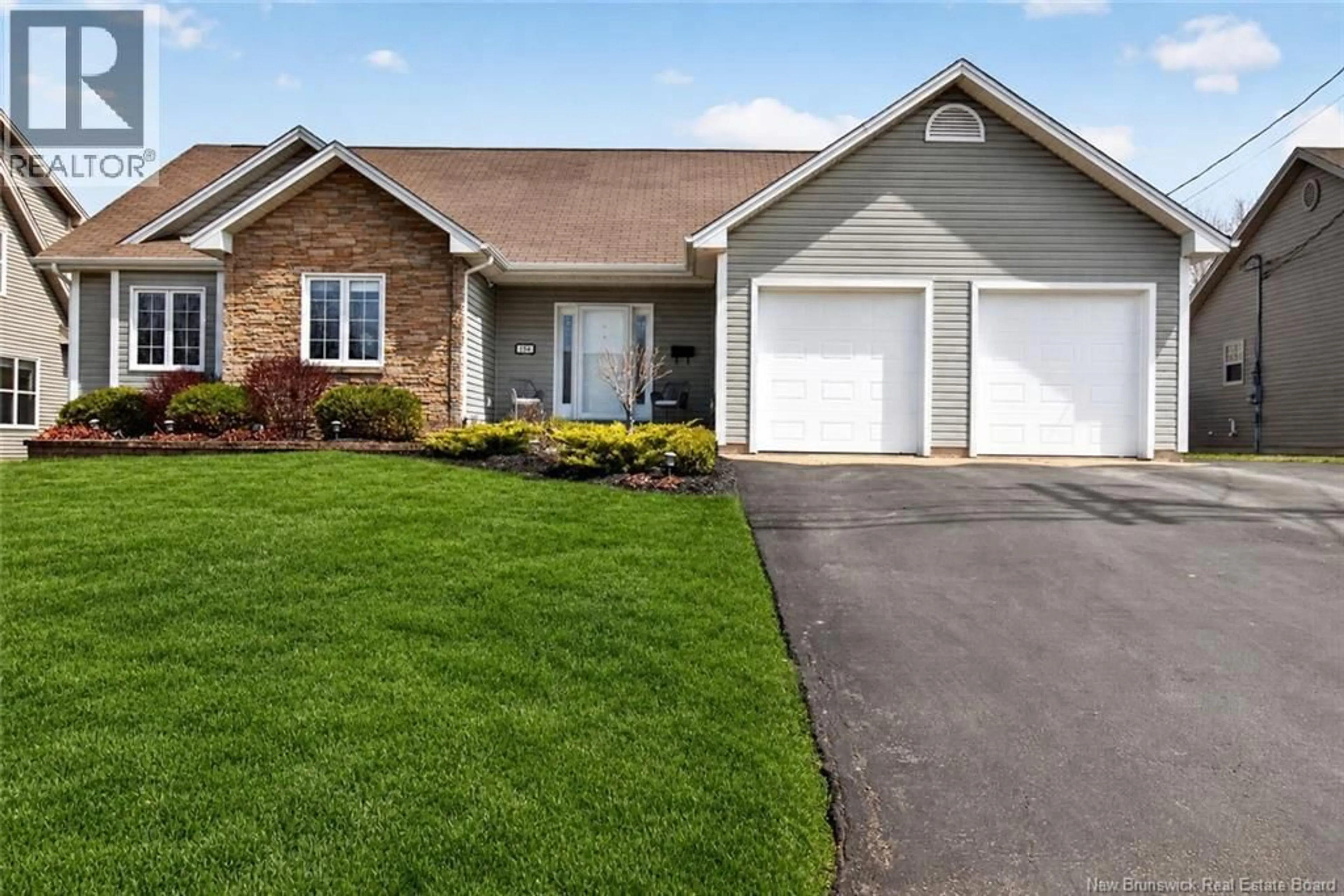 Home with vinyl exterior material, street for 154 ERINVALE DRIVE, Moncton New Brunswick E1A5S7