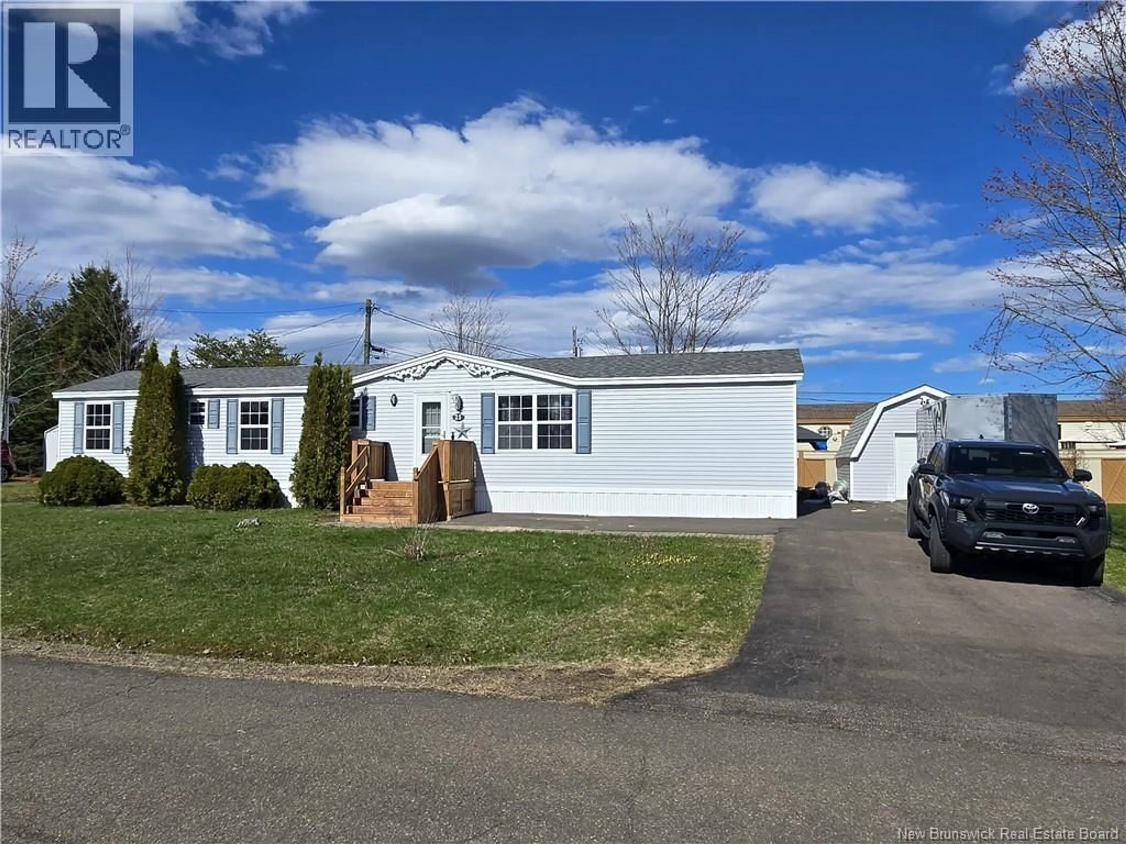 Home with vinyl exterior material, street for 21 CAROUGE STREET, Moncton New Brunswick E1H2T3