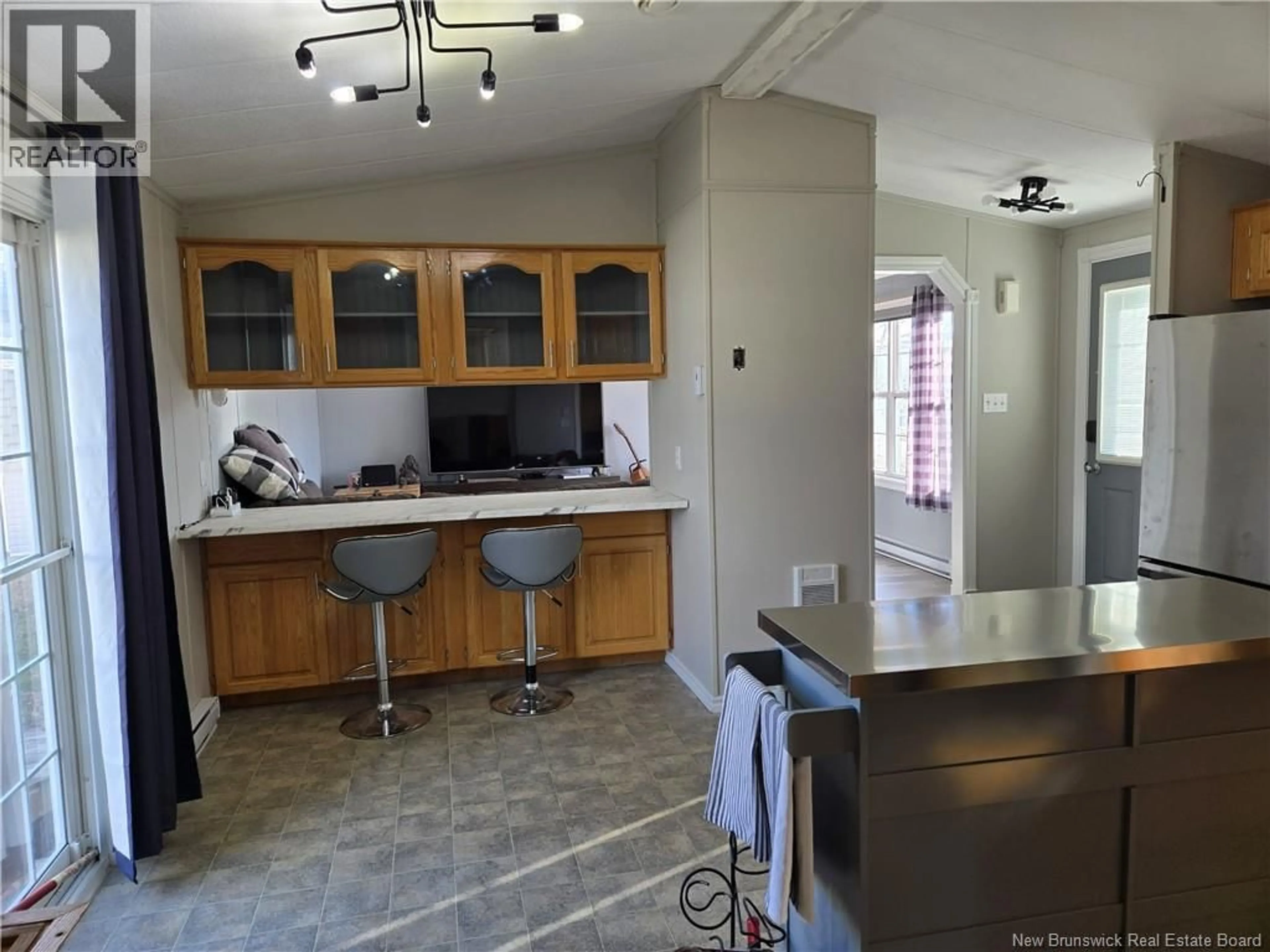 Open concept kitchen, ceramic/tile floor for 21 CAROUGE STREET, Moncton New Brunswick E1H2T3