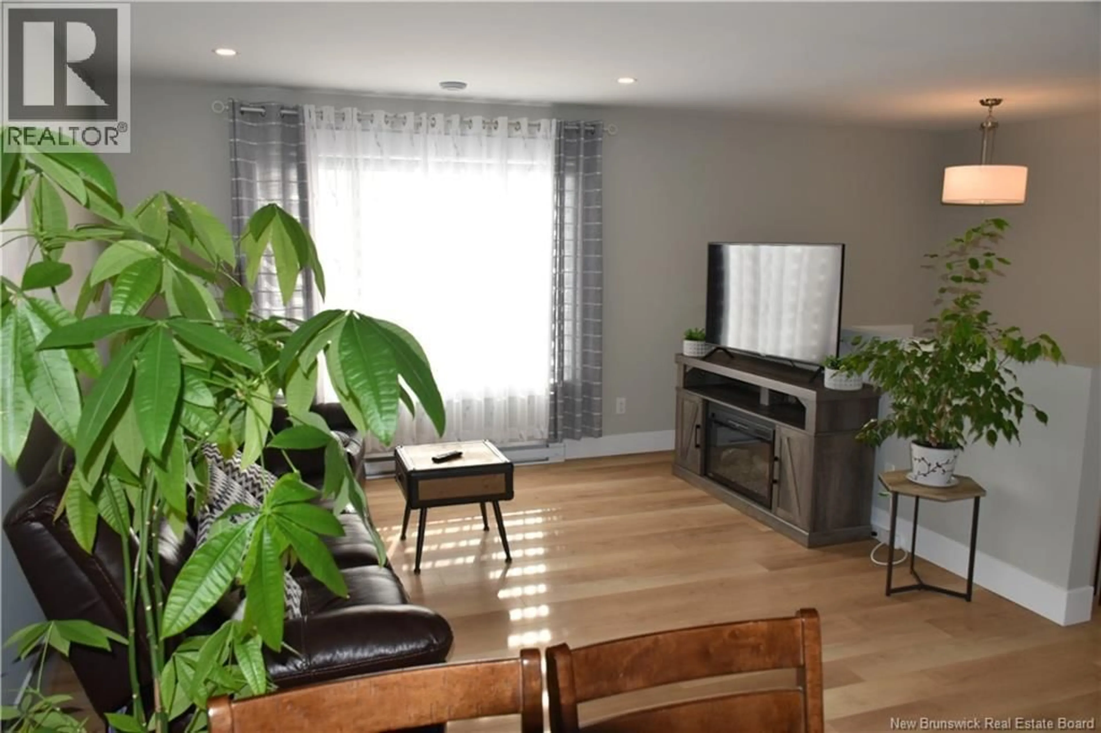 Living room with furniture, wood/laminate floor for 22 MIA STREET, Shediac New Brunswick E4P0Z8