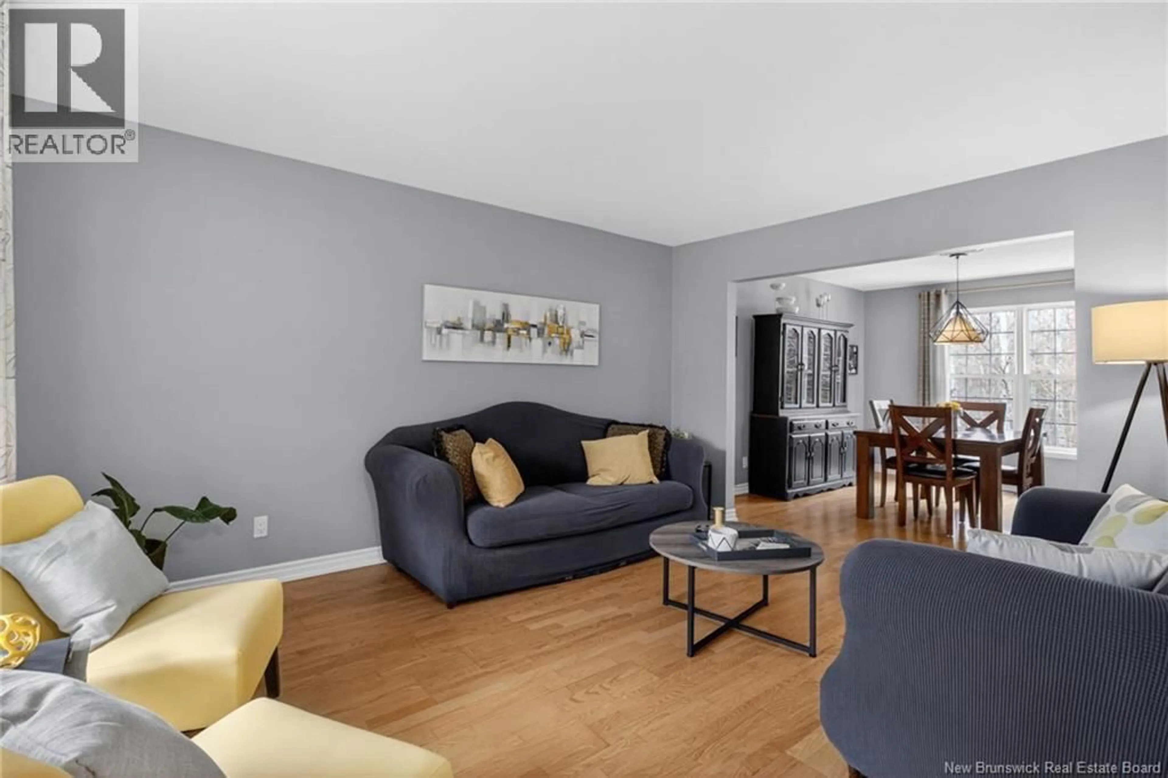 Living room with furniture, wood/laminate floor for 91 GREENWICH DRIVE, Moncton New Brunswick E1A7A9