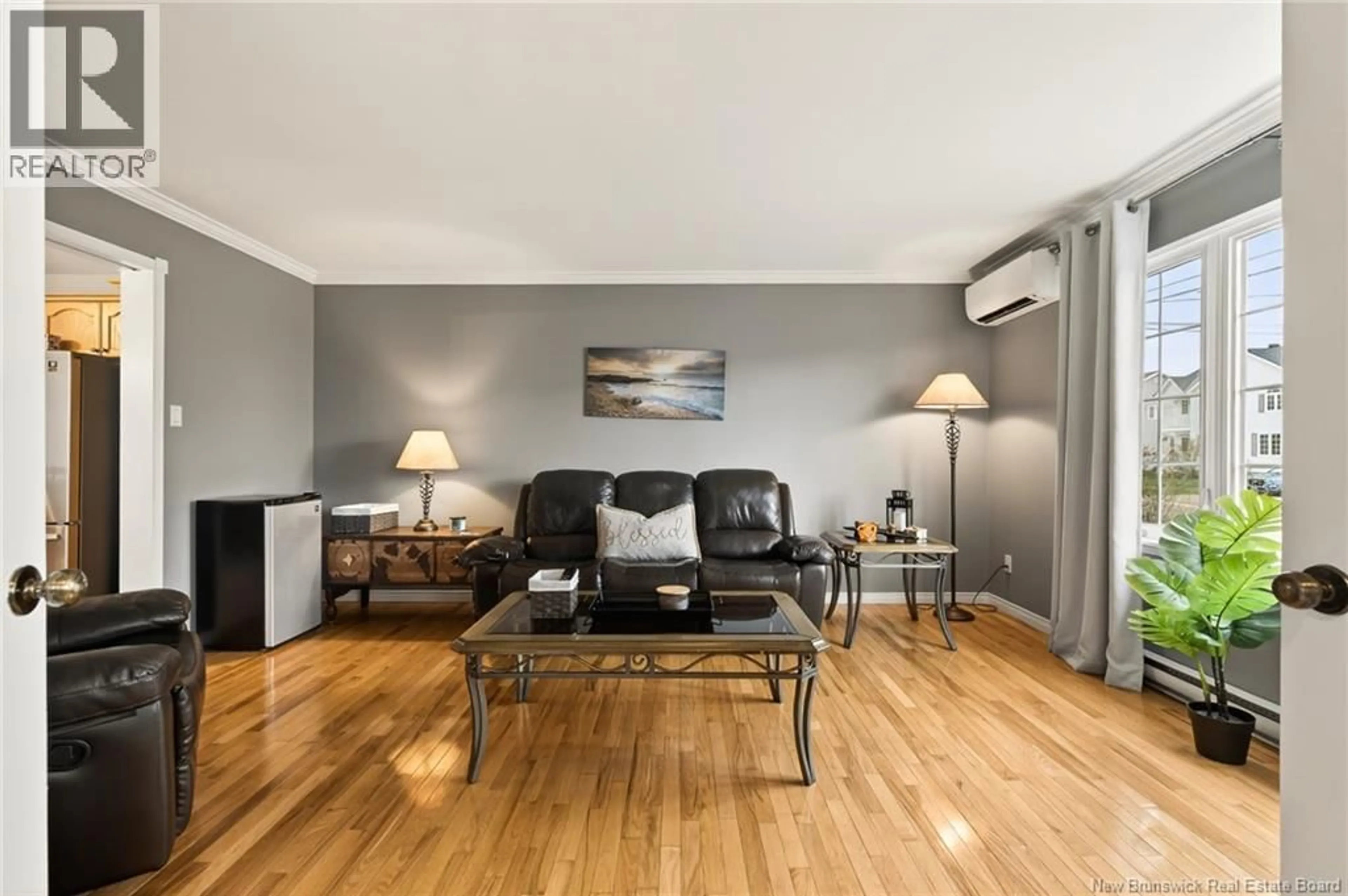 Living room with furniture, wood/laminate floor for 40 STONEHAM DRIVE, Moncton New Brunswick E1G4Z6