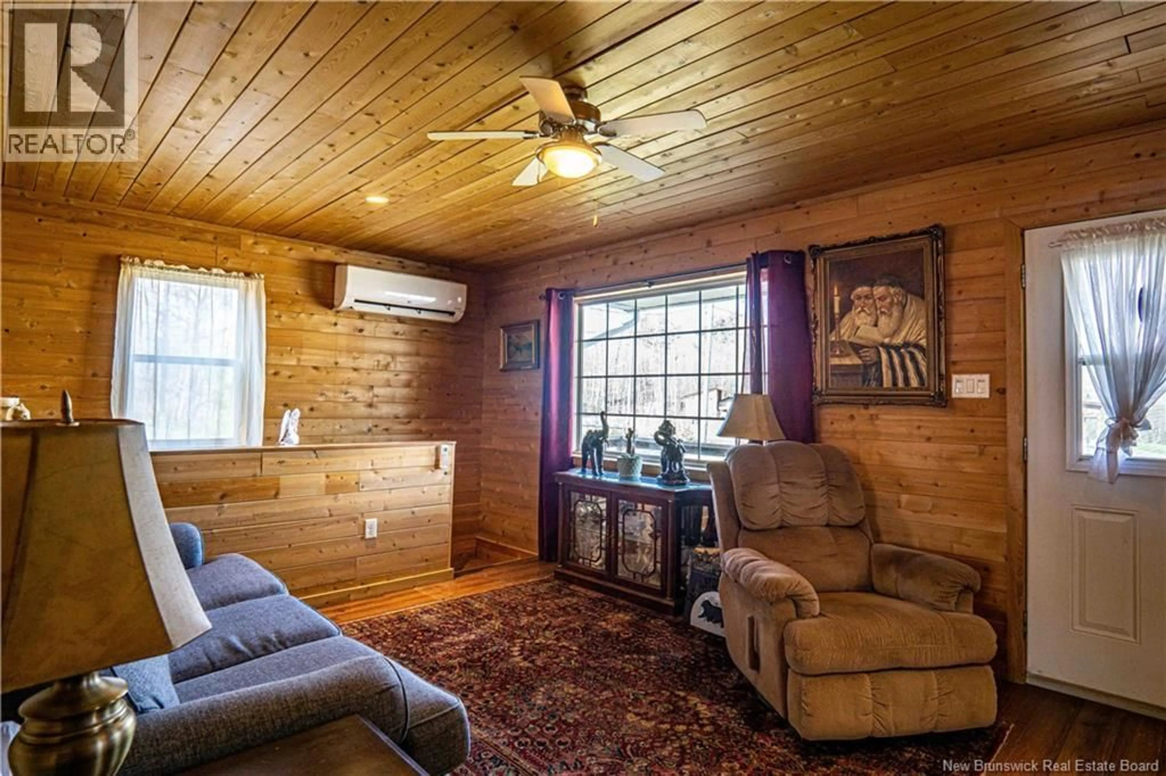 Living room with furniture, wood/laminate floor for 10 EDGEWATER LANE, Cumberland Bay New Brunswick E4A3G9