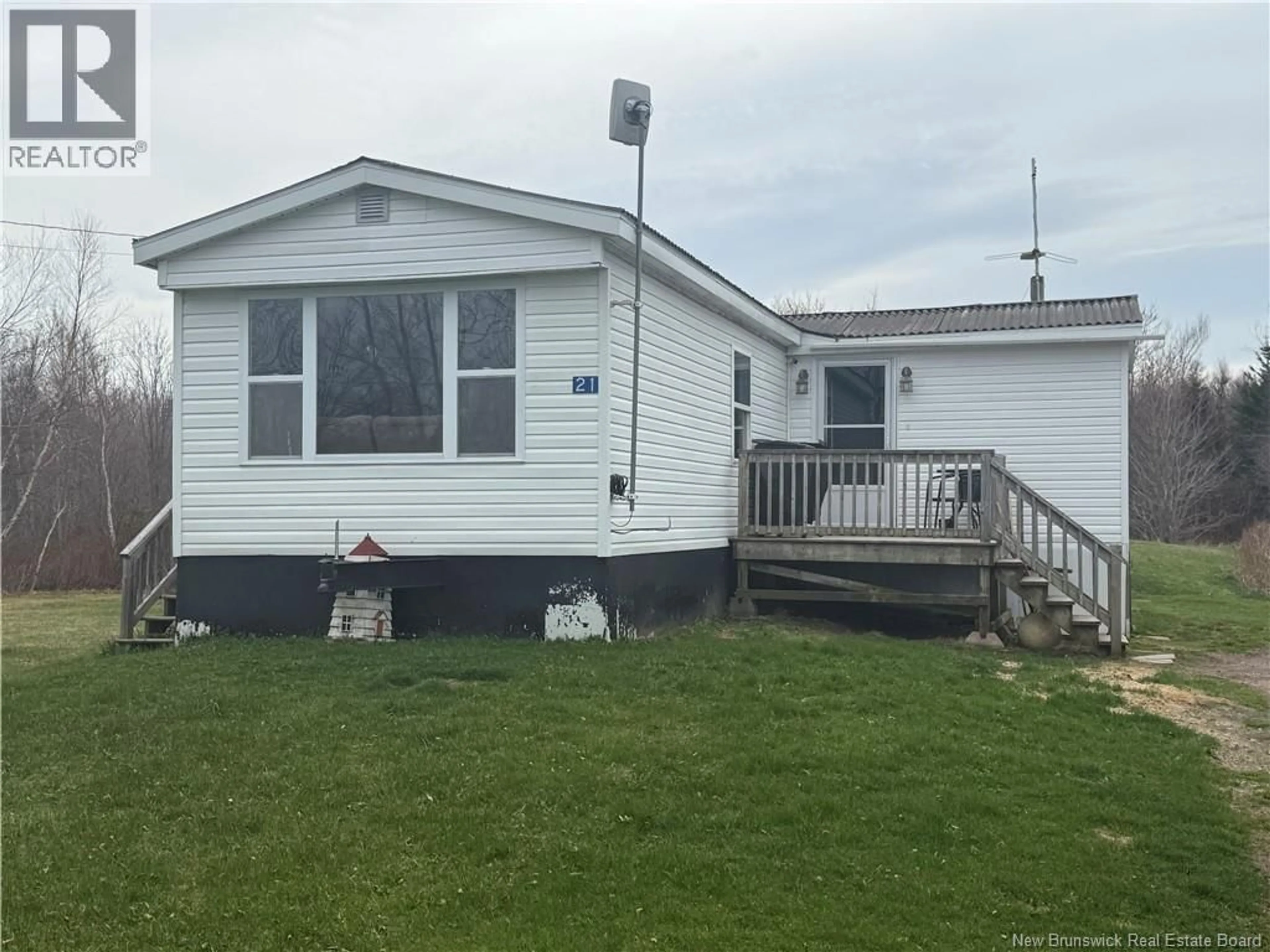 Home with vinyl exterior material, street for 21 TRENHOLM ROAD, Murray Corner New Brunswick E4M3C9