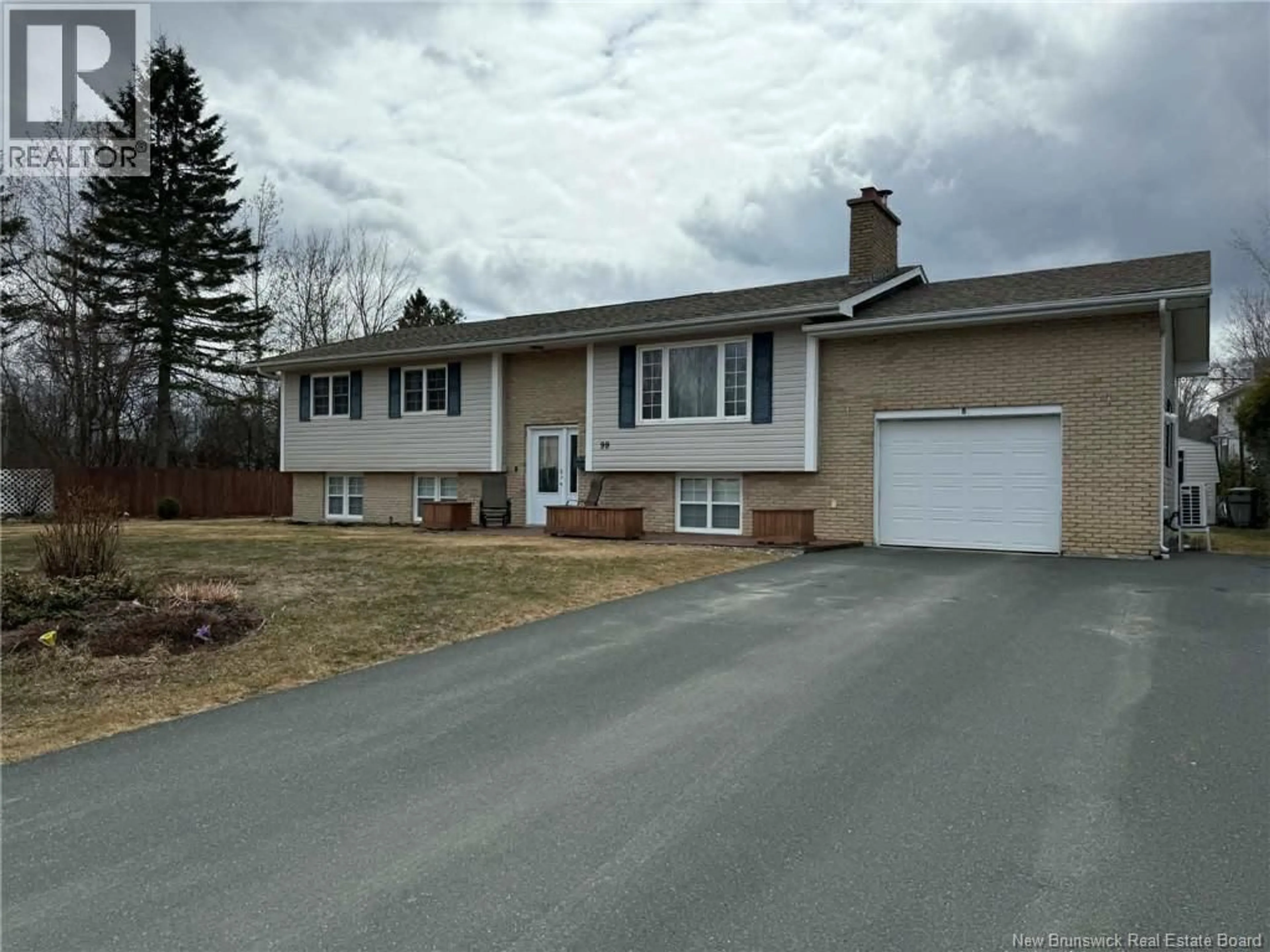 Home with vinyl exterior material, street for 99 STOTHART DRIVE, Miramichi New Brunswick E1V3T9