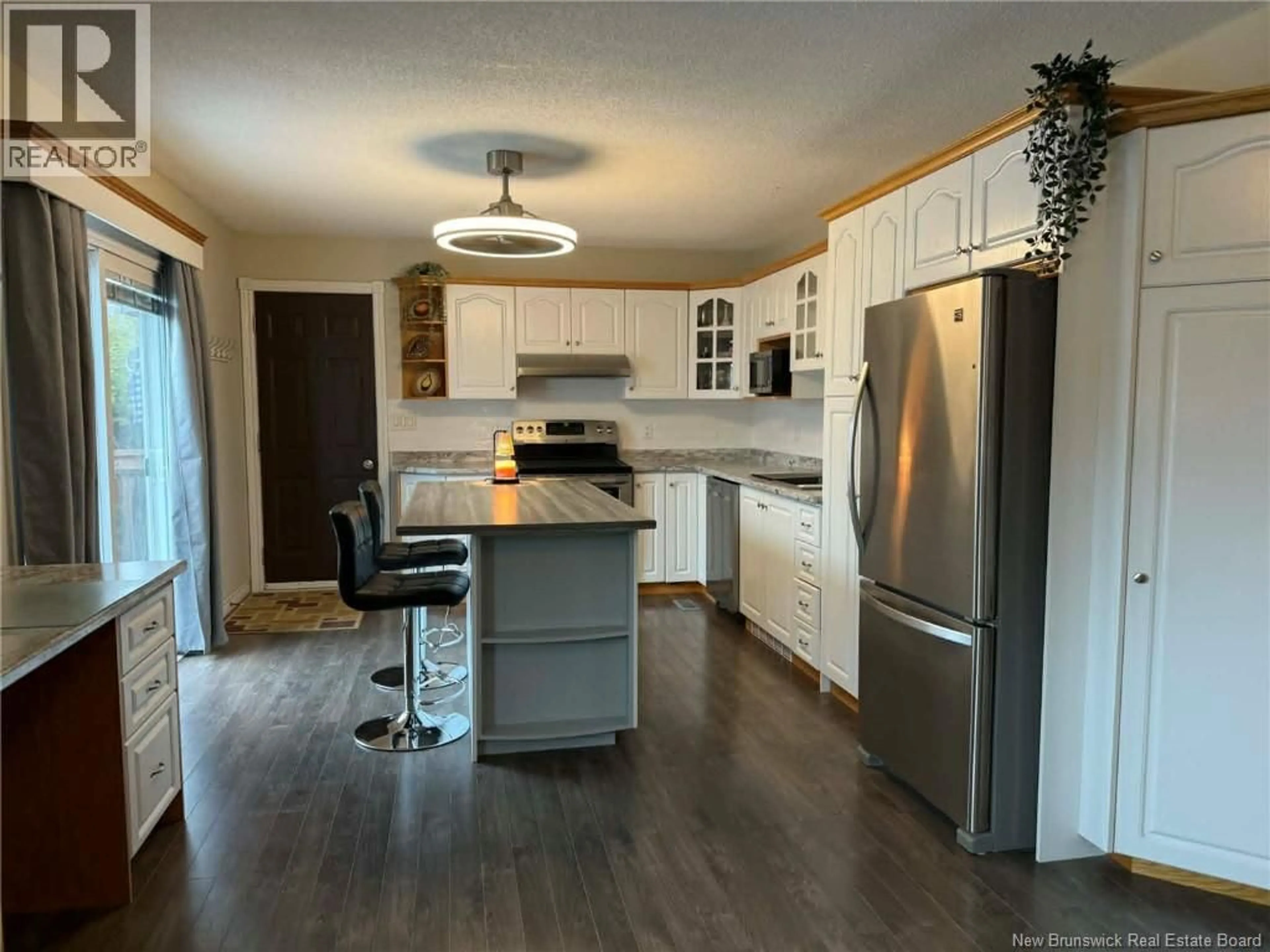 Open concept kitchen, wood/laminate floor for 99 STOTHART DRIVE, Miramichi New Brunswick E1V3T9