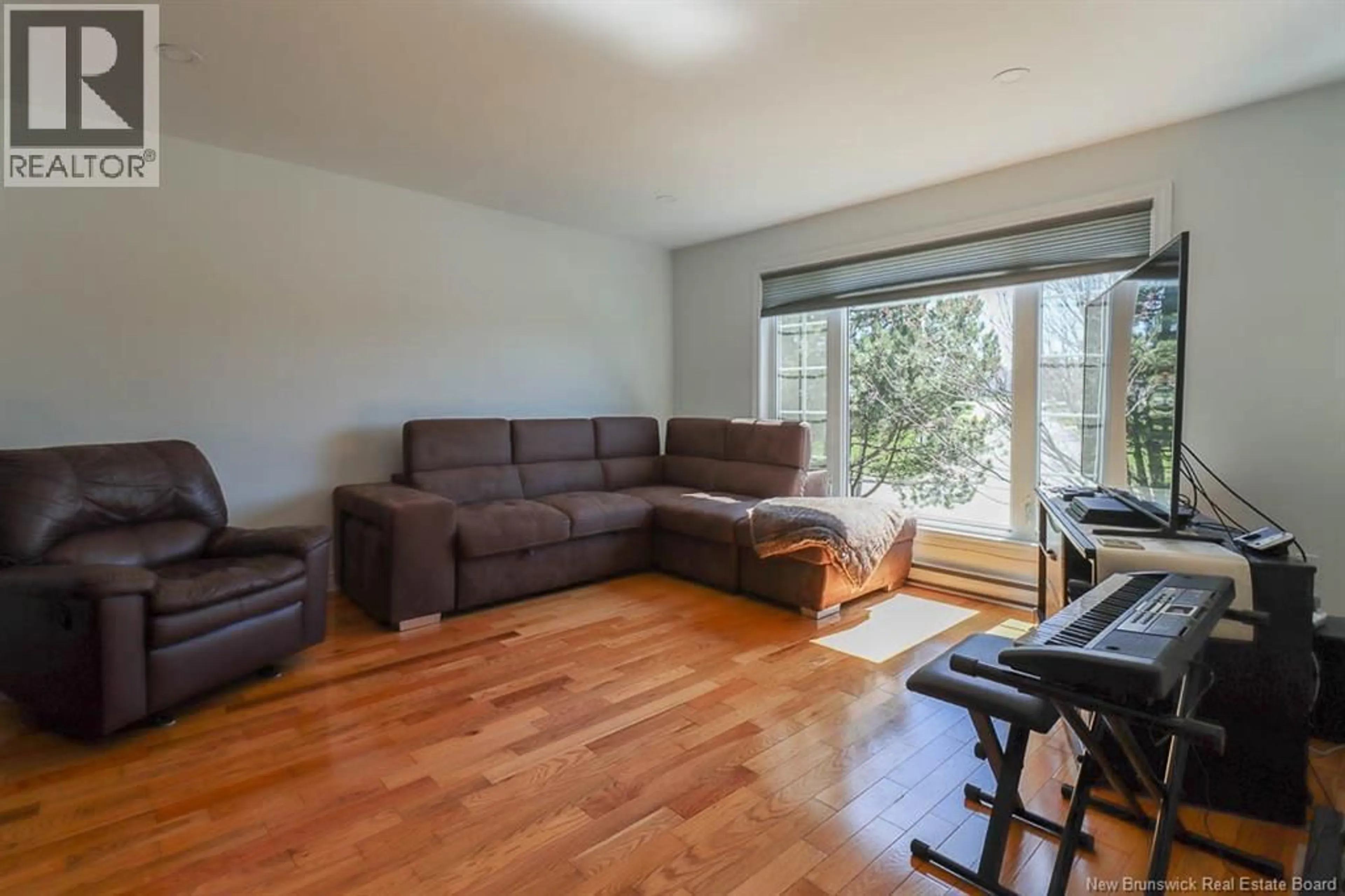 Living room with furniture, wood/laminate floor for 7 DALILA COURT, Saint John New Brunswick E2M5P9