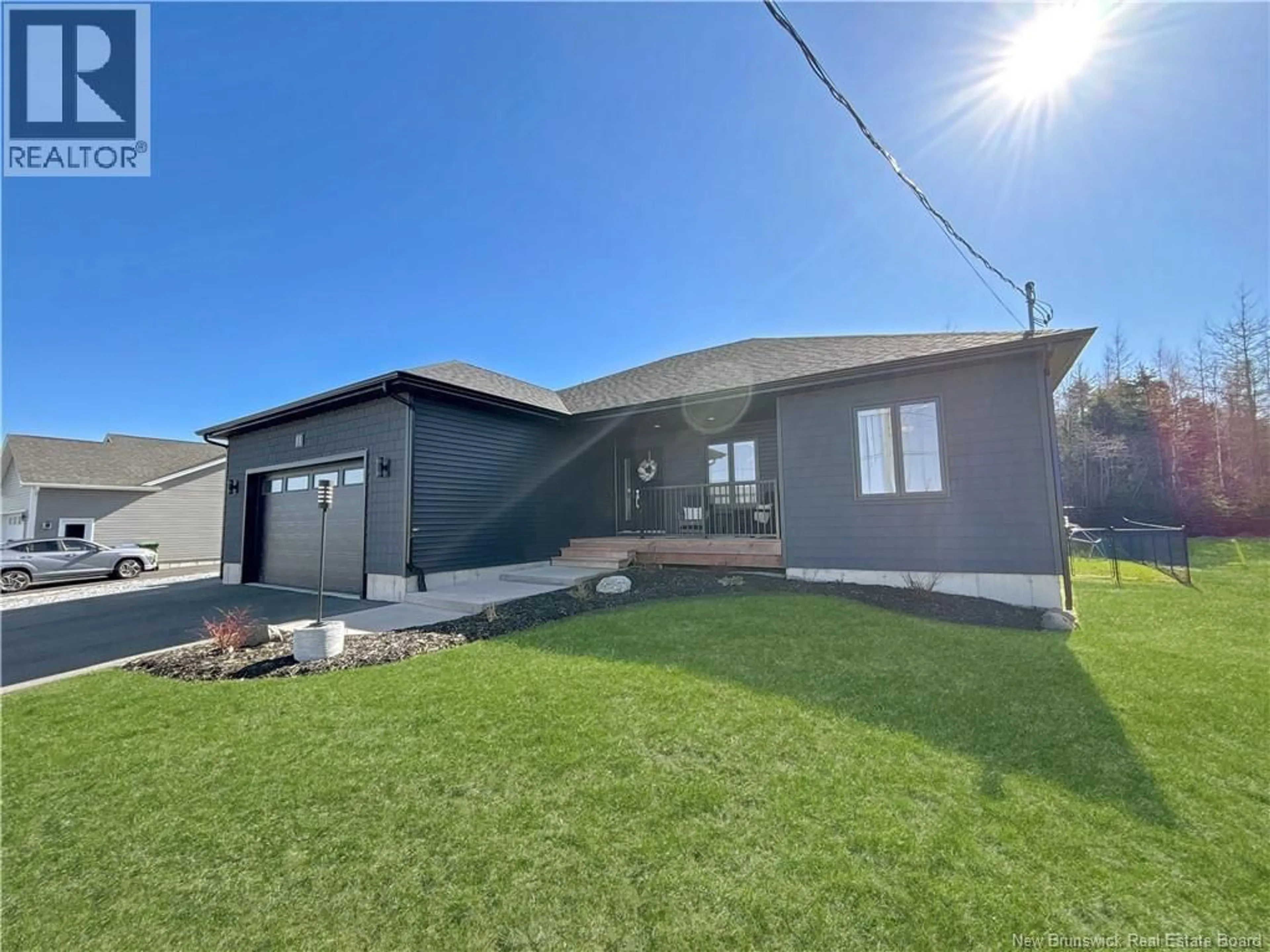 A pic from outside/outdoor area/front of a property/back of a property/a pic from drone, street for 11 ORIOLE LANE, Quispamsis New Brunswick E2E0S6