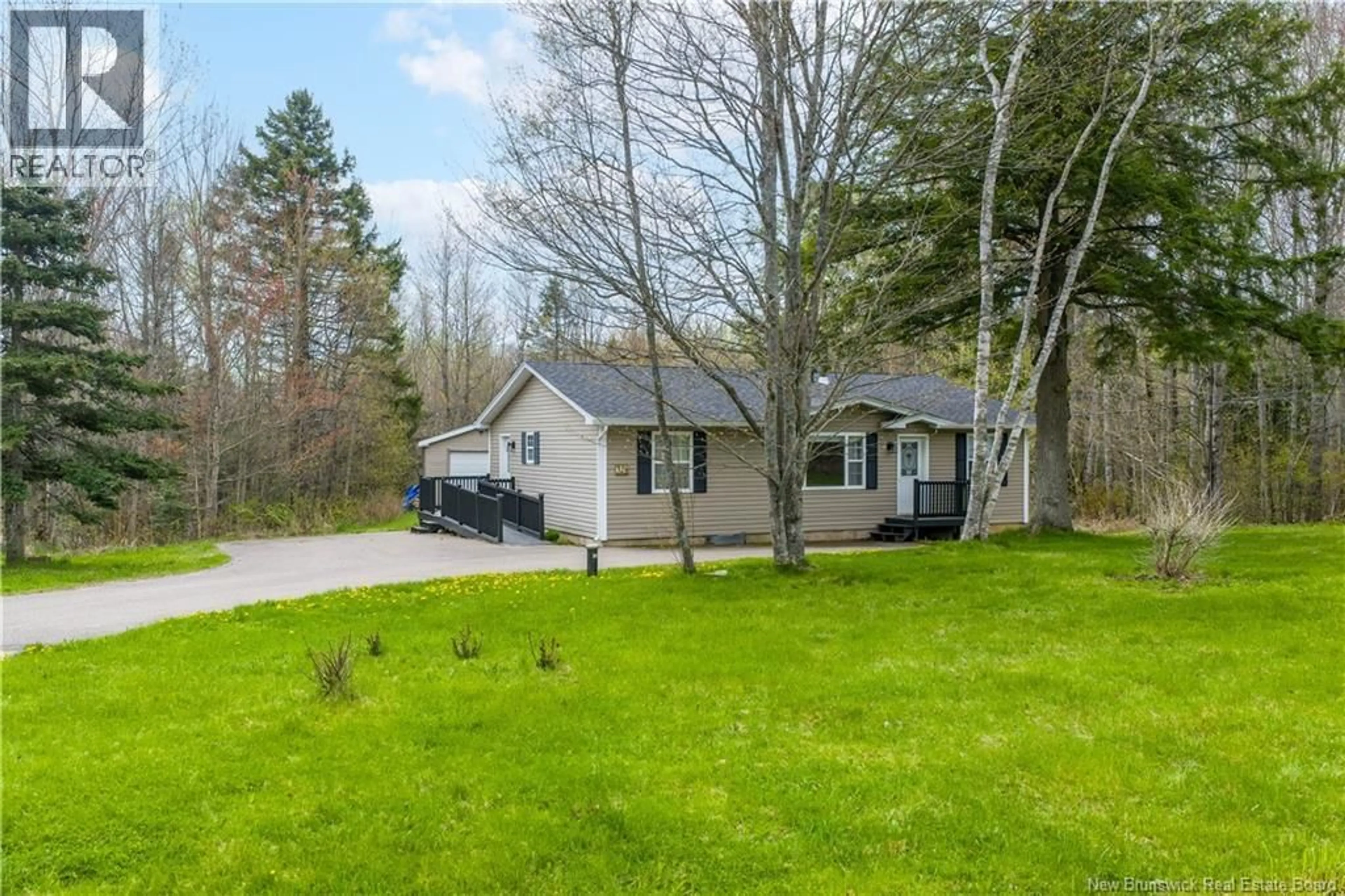 A pic from outside/outdoor area/front of a property/back of a property/a pic from drone, unknown for 32 WILDWOOD CRESCENT, Roachville New Brunswick E4G2K7