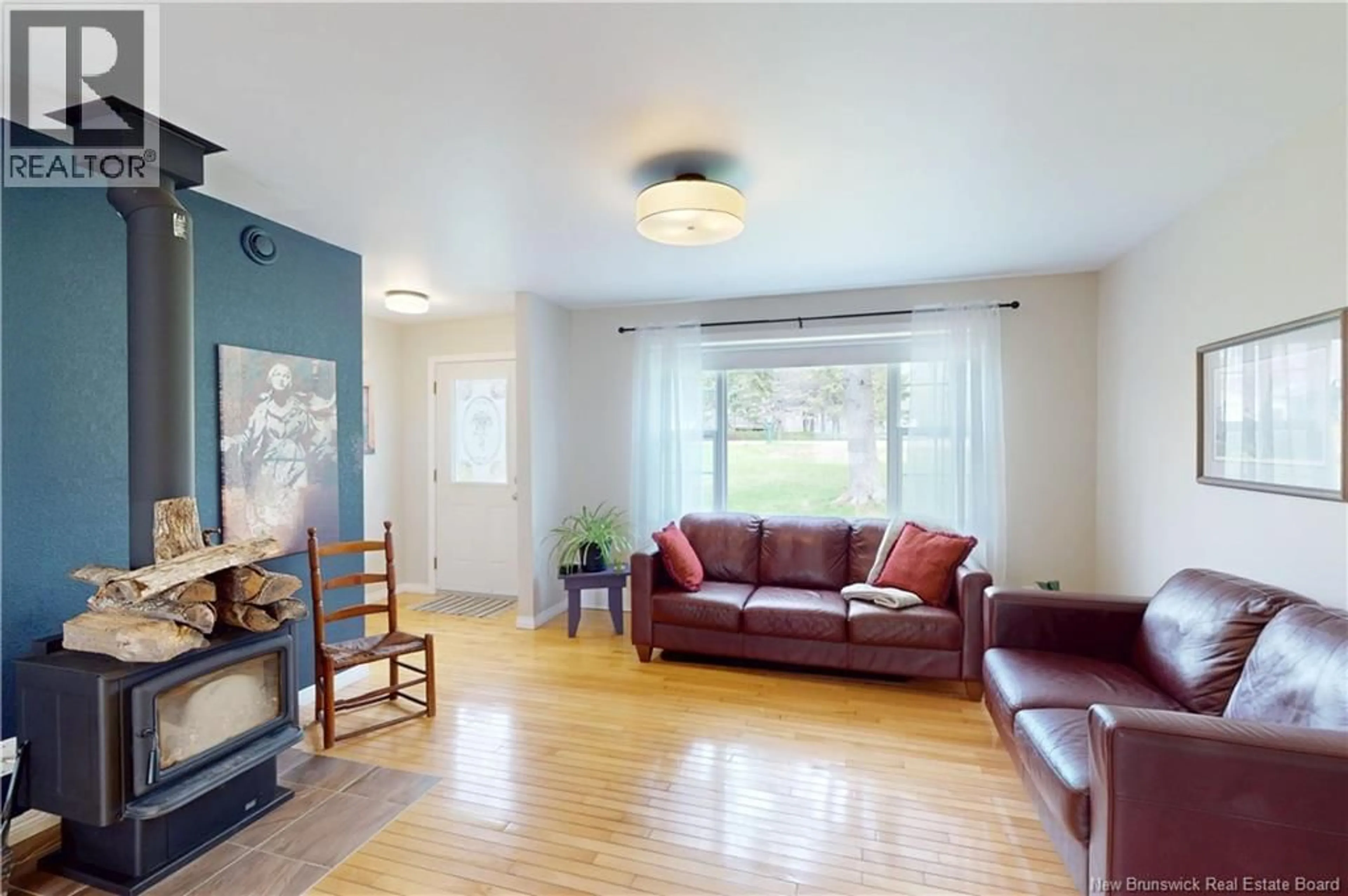 Living room with furniture, wood/laminate floor for 32 WILDWOOD CRESCENT, Roachville New Brunswick E4G2K7