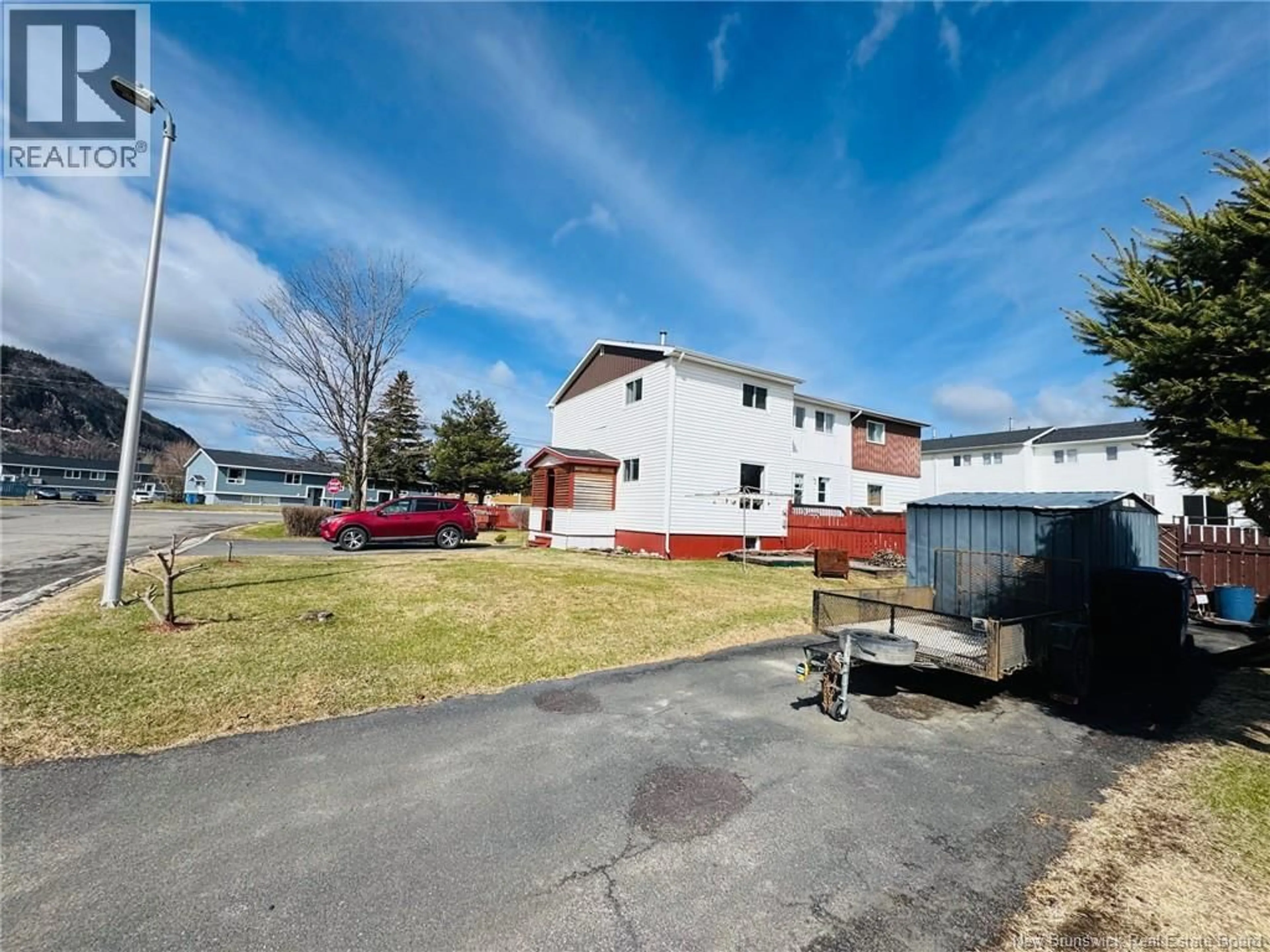 A pic from outside/outdoor area/front of a property/back of a property/a pic from drone, street for 6 GALLANT DRIVE, Campbellton New Brunswick E3N2T6
