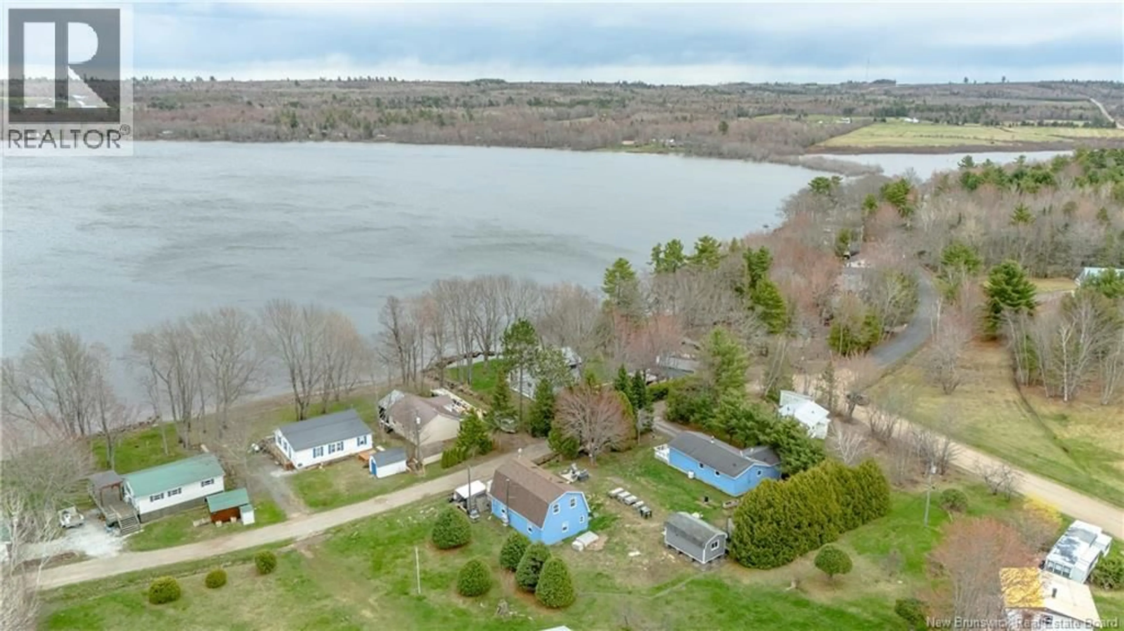 A pic from outside/outdoor area/front of a property/back of a property/a pic from drone, water/lake/river/ocean view for 156 MEADOW LANE, Jemseg New Brunswick E4C3Z3