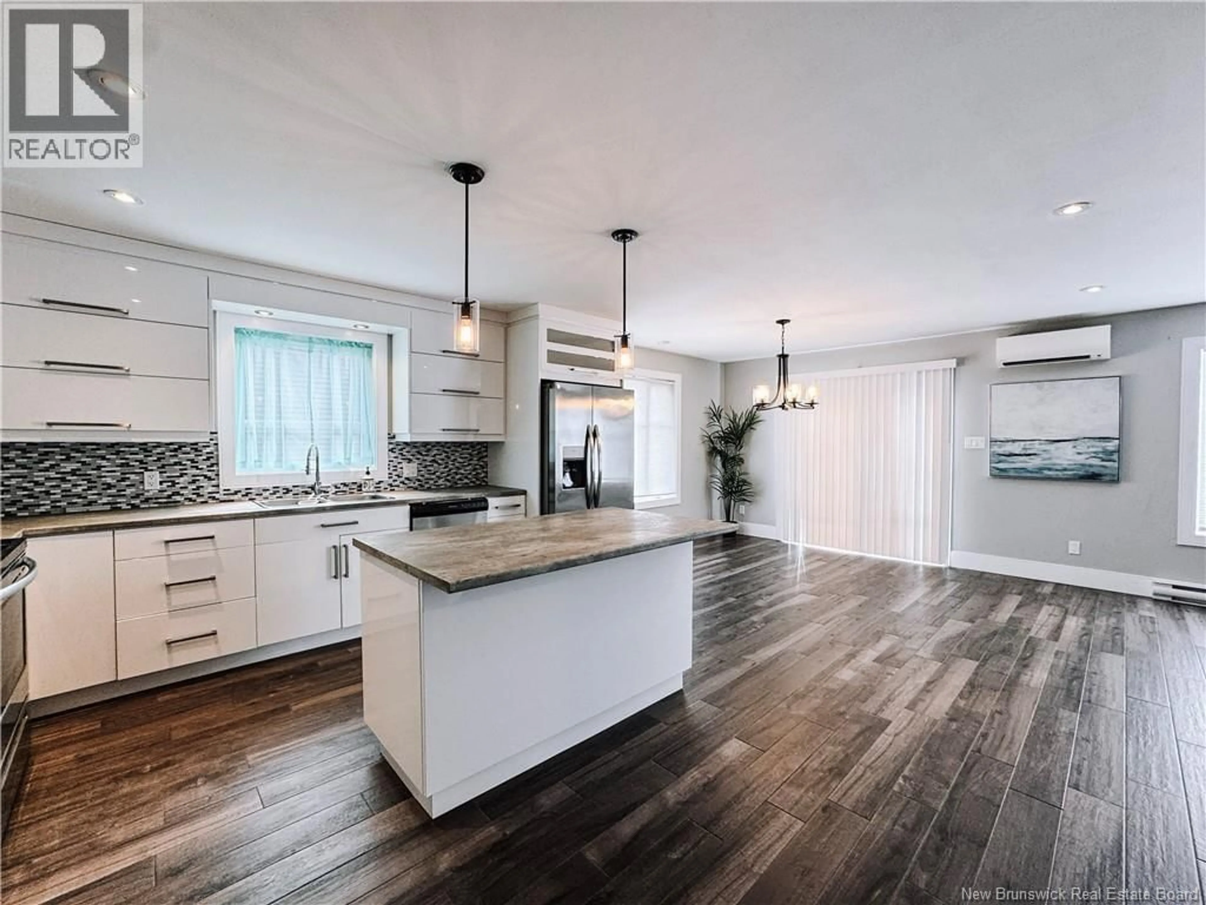 Open concept kitchen, wood/laminate floor for 115 TIMANDRA CRESCENT, Moncton New Brunswick E1G5Y3