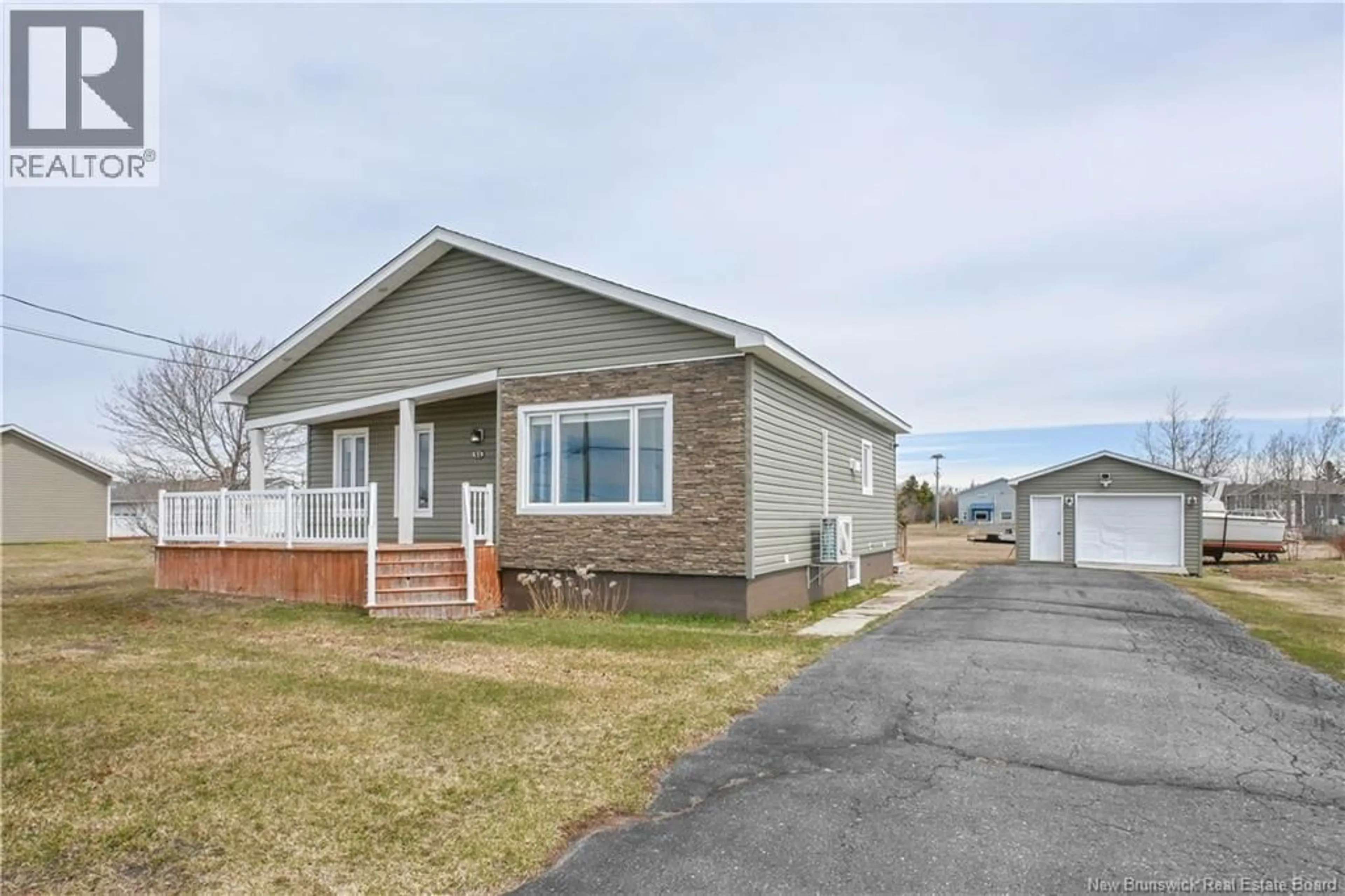 Home with vinyl exterior material, street for 51 CHIASSON ROAD, Savoie Landing New Brunswick E8S3B5