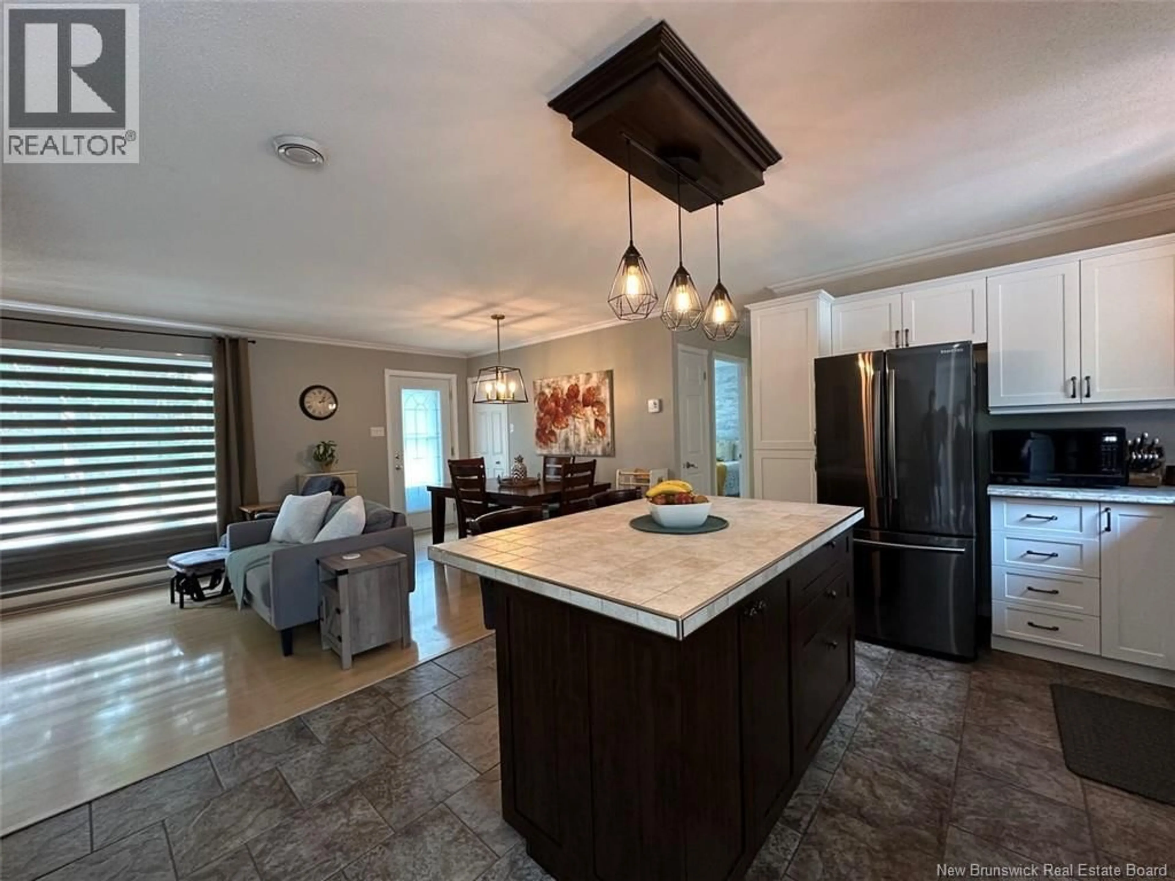 Open concept kitchen, ceramic/tile floor for 66 DES PRÉS STREET, Edmundston New Brunswick E3V5A7