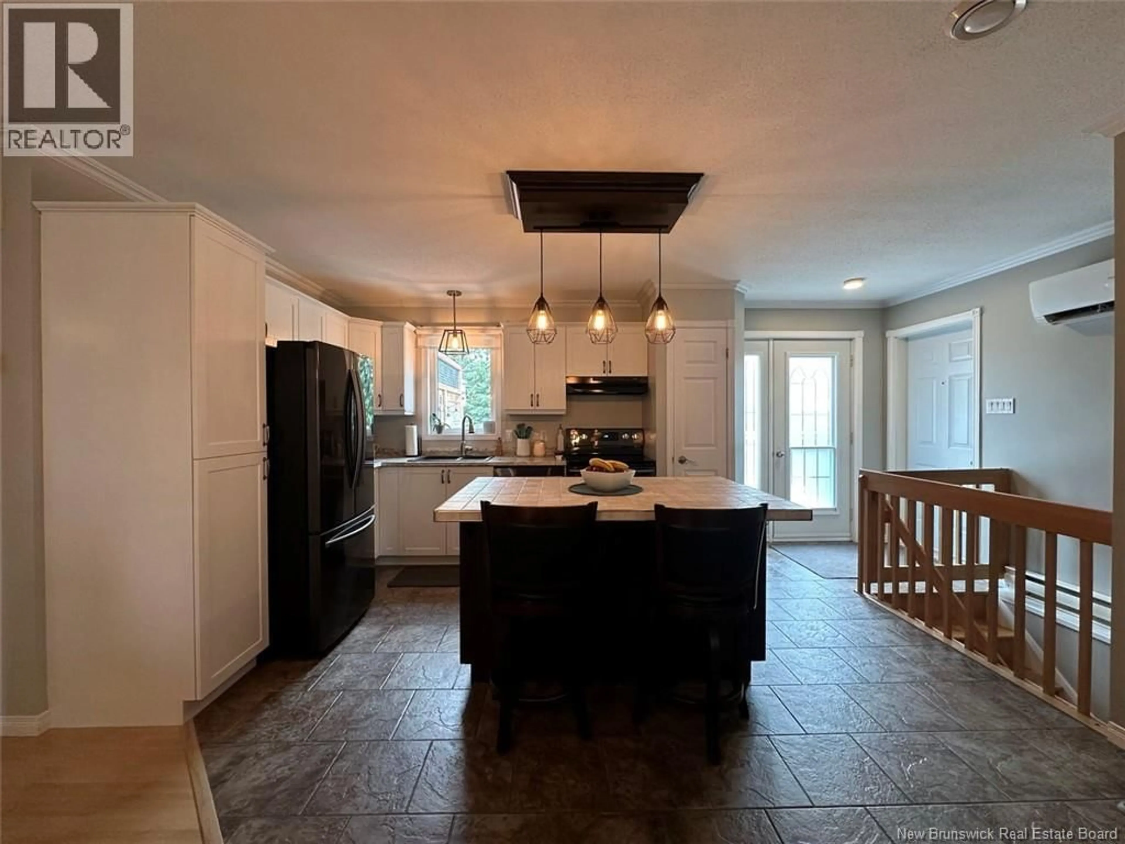 Open concept kitchen, ceramic/tile floor for 66 DES PRÉS STREET, Edmundston New Brunswick E3V5A7