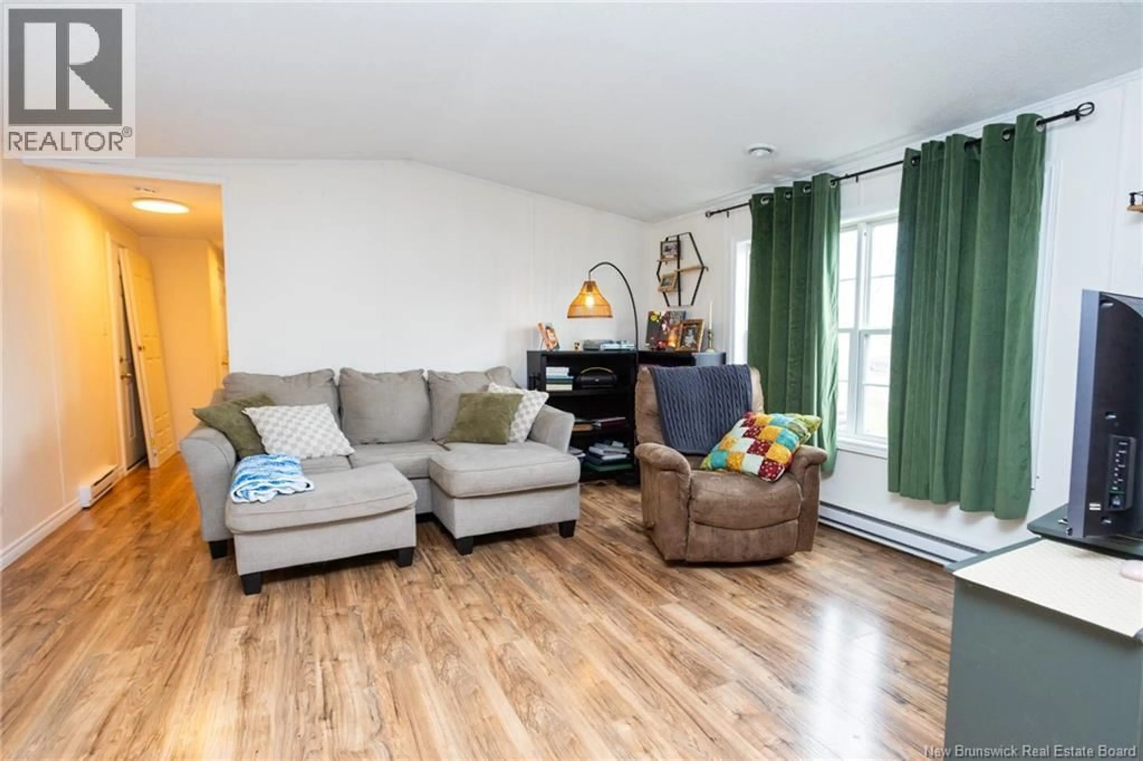 Living room with furniture, wood/laminate floor for 100 DOUGNORTH STREET, Fredericton New Brunswick E3G0X2
