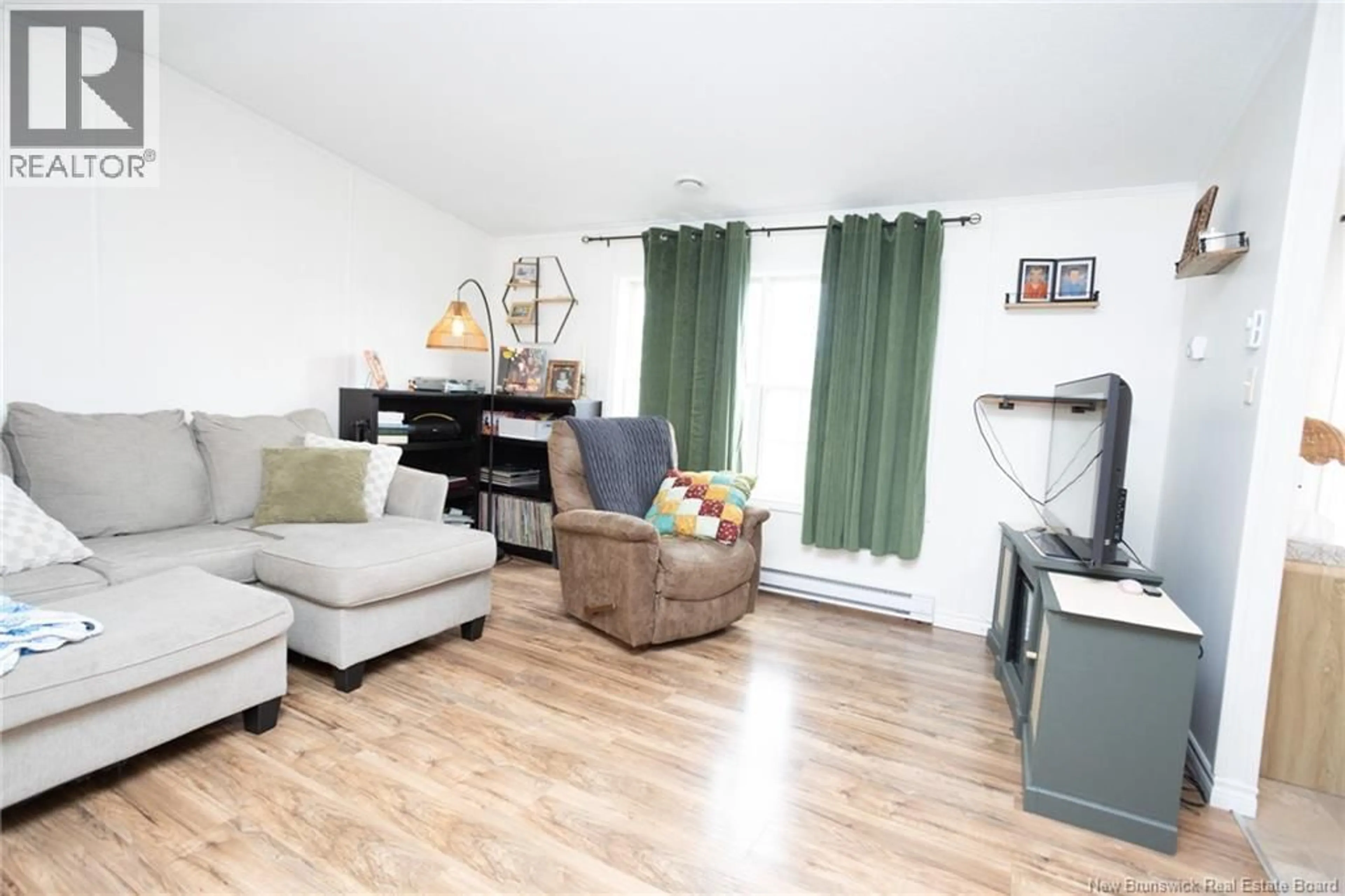 Living room with furniture, wood/laminate floor for 100 DOUGNORTH STREET, Fredericton New Brunswick E3G0X2