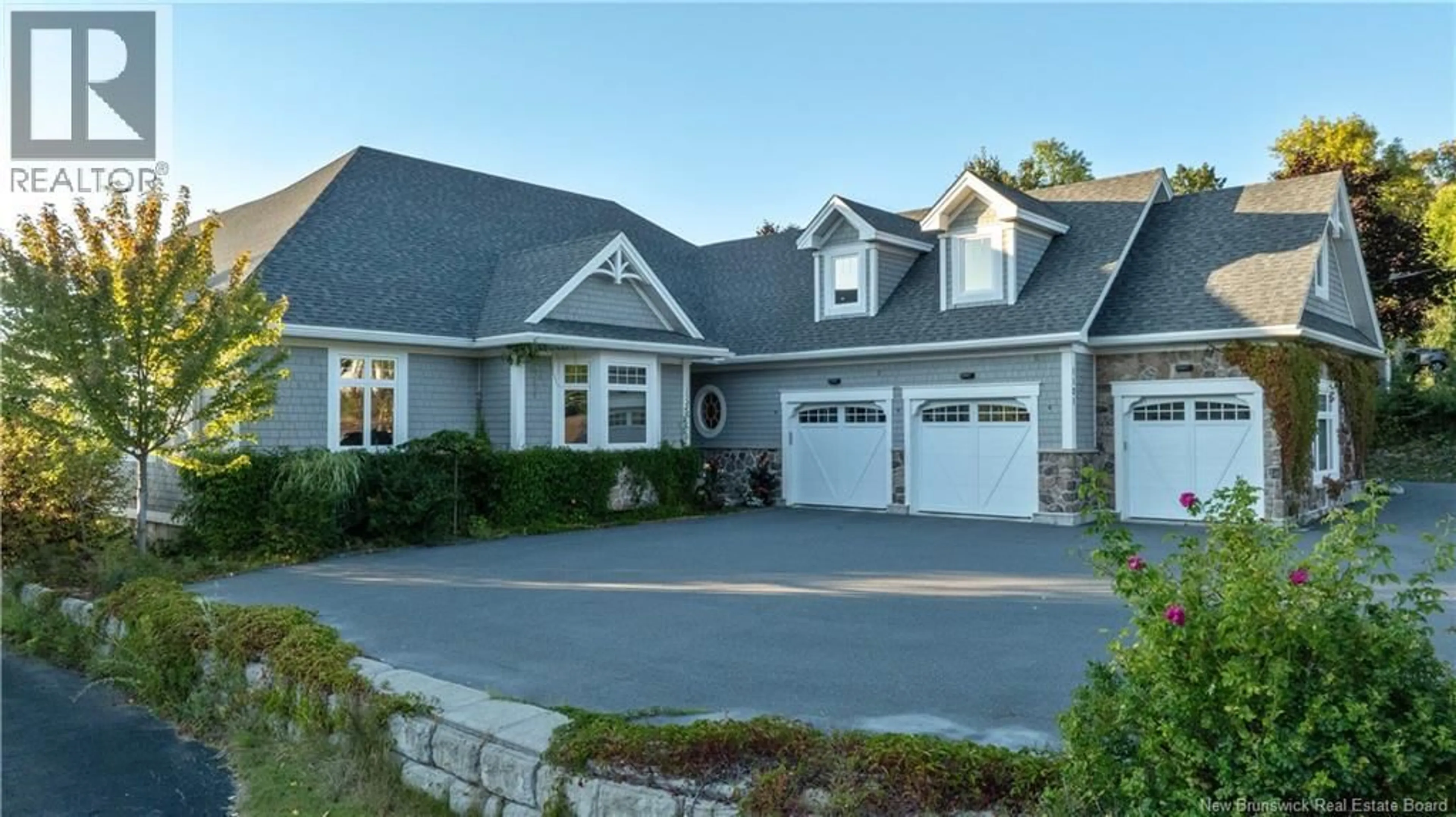 Home with vinyl exterior material, street for 1121 KENNEBECASIS DRIVE, Saint John New Brunswick E2K5A7