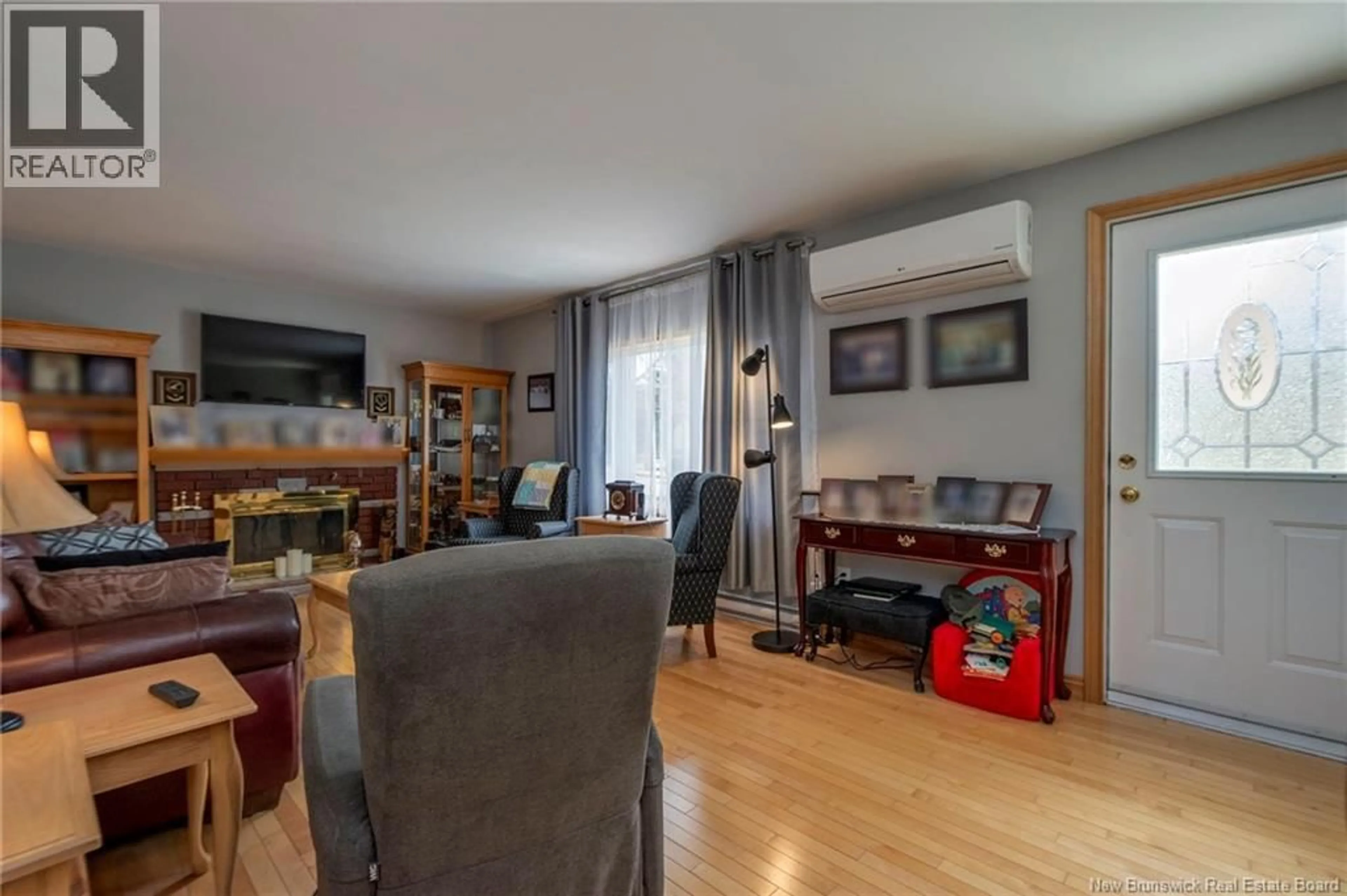 Living room with furniture, wood/laminate floor for 24 GLENGARRY DRIVE, Saint John New Brunswick E2J2Y3