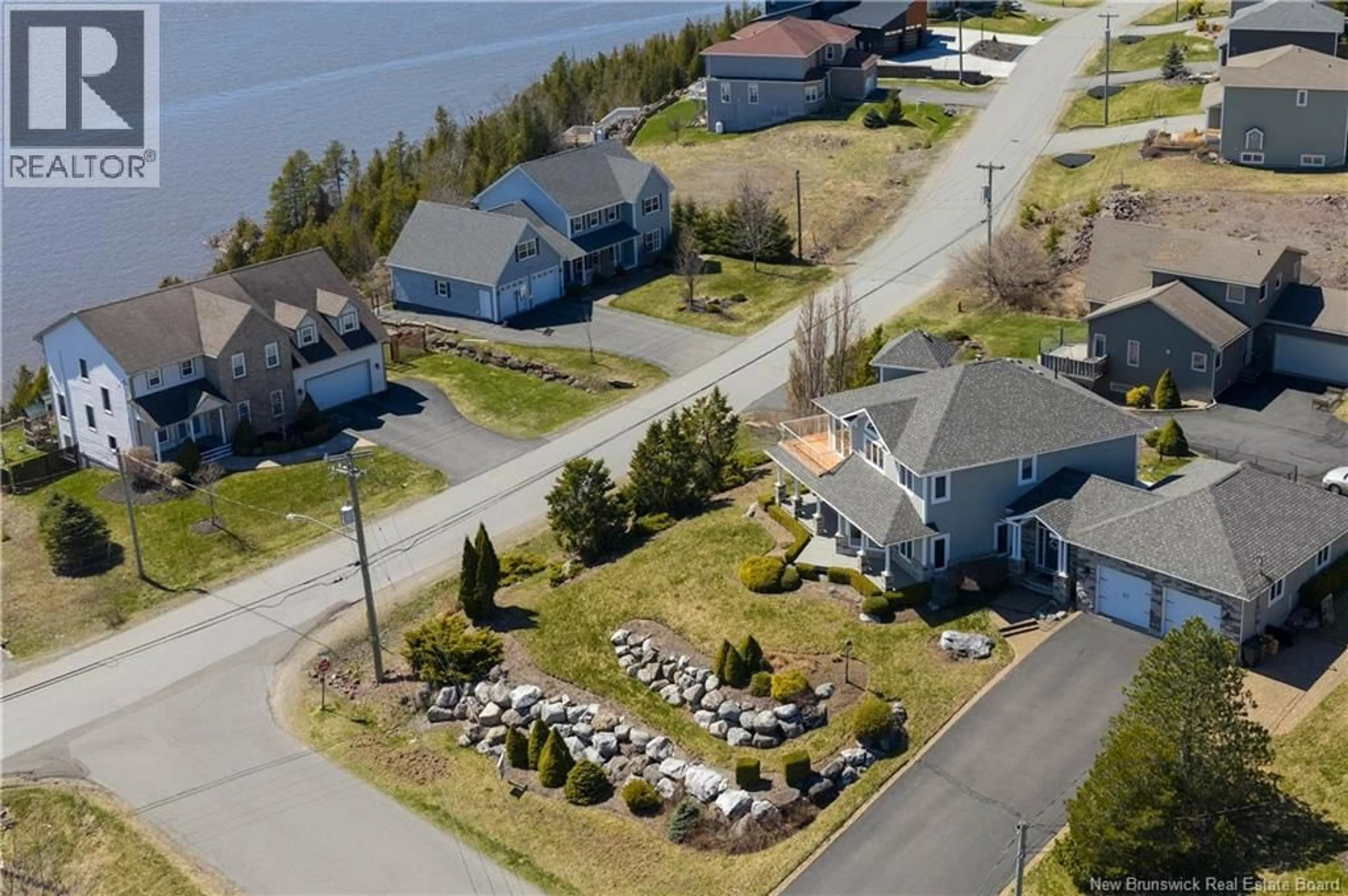 A pic from outside/outdoor area/front of a property/back of a property/a pic from drone, water/lake/river/ocean view for 5 ADMIRALTY DRIVE, Saint John New Brunswick E2K5R4