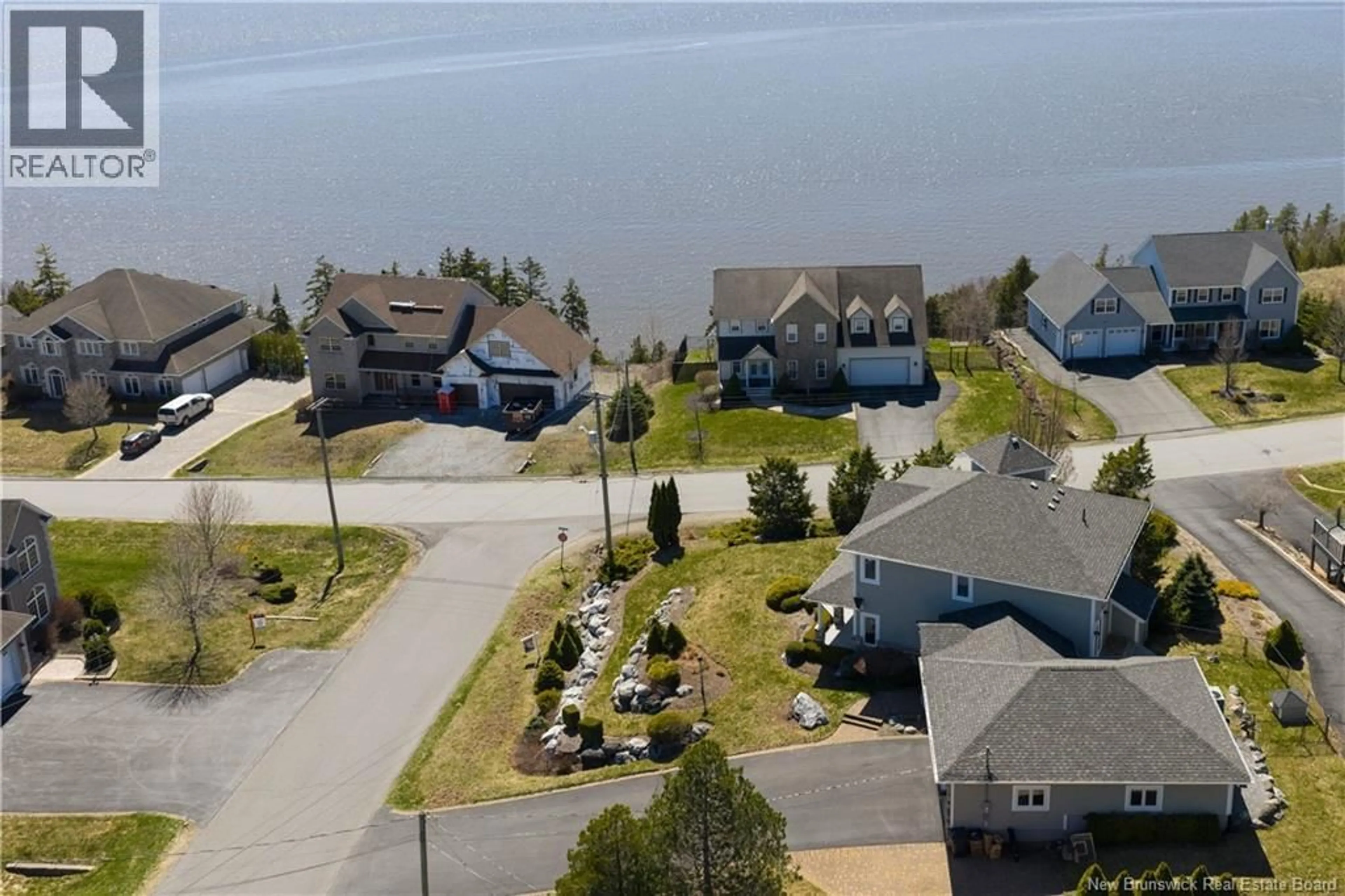 A pic from outside/outdoor area/front of a property/back of a property/a pic from drone, water/lake/river/ocean view for 5 ADMIRALTY DRIVE, Saint John New Brunswick E2K5R4