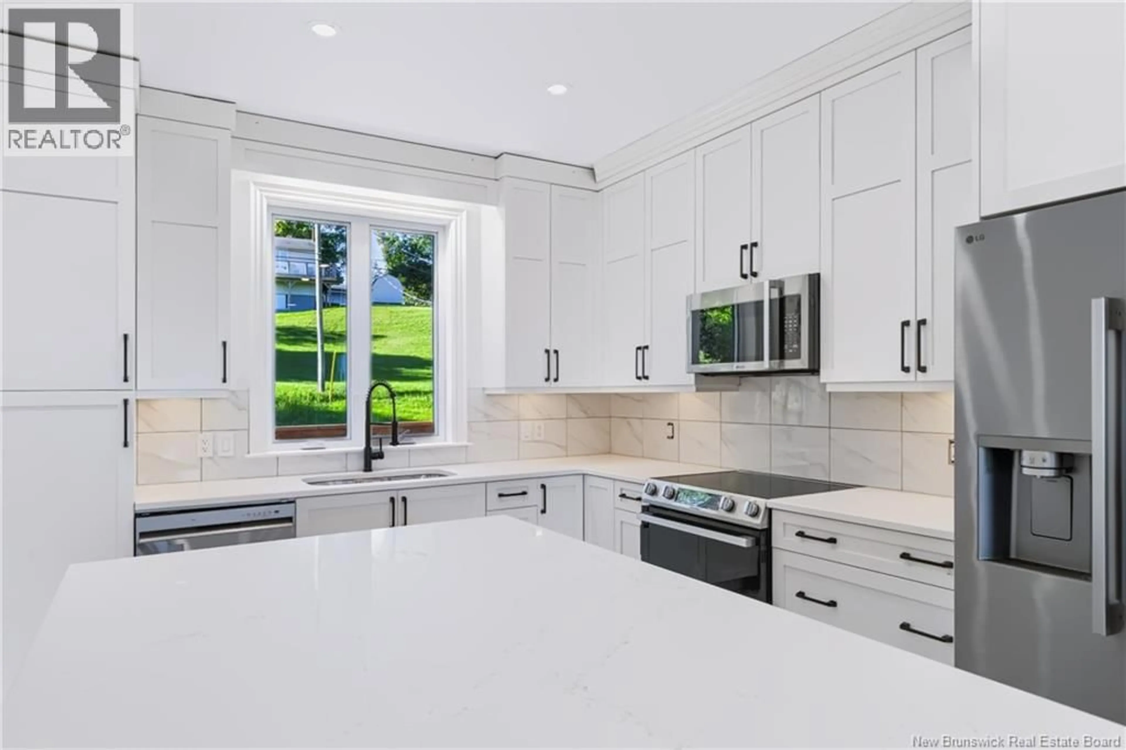 Open concept kitchen, ceramic/tile floor for 16 MAYFLOWER STREET, Fredericton New Brunswick E3C1L5