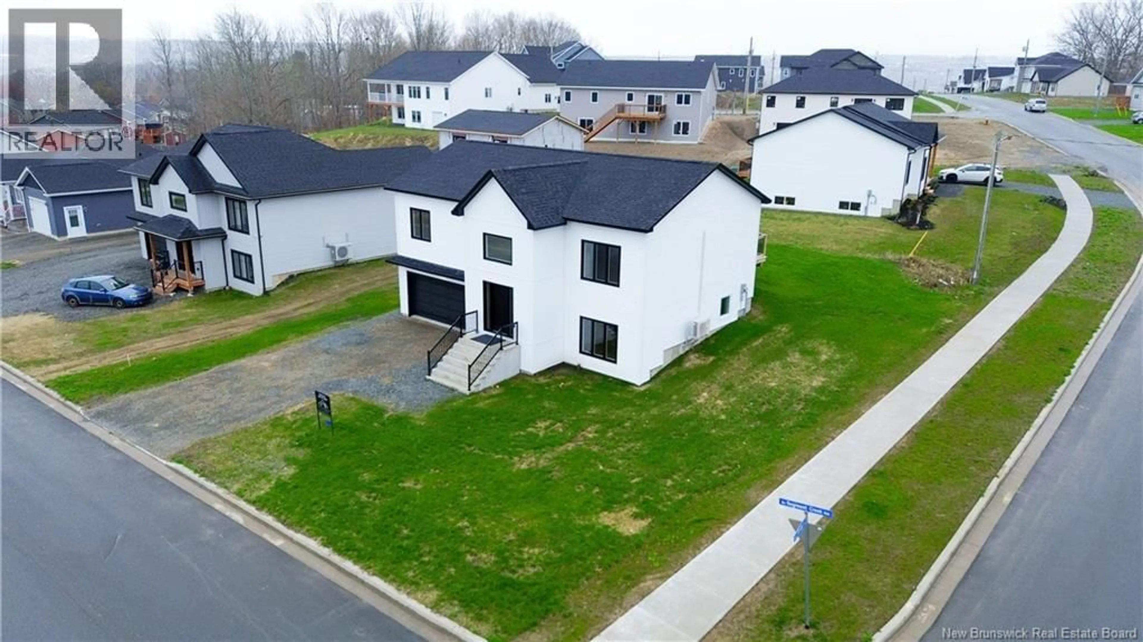 A pic from outside/outdoor area/front of a property/back of a property/a pic from drone, street for 141 REGIMENT CREEK AVENUE, Fredericton New Brunswick E3G0G3