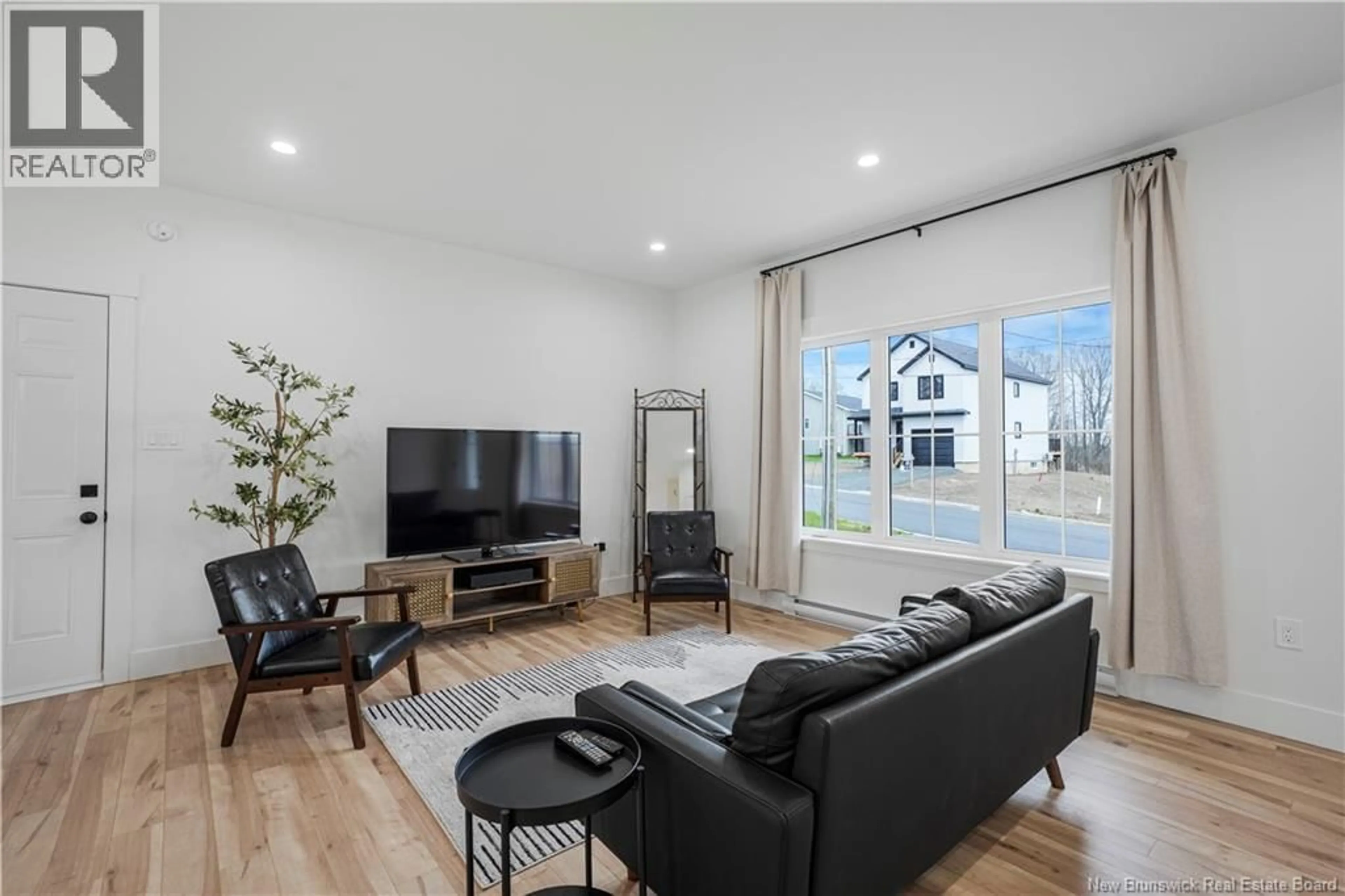 Living room with furniture, unknown for 201 GILRIDGE DRIVE, Fredericton New Brunswick E3G9W7