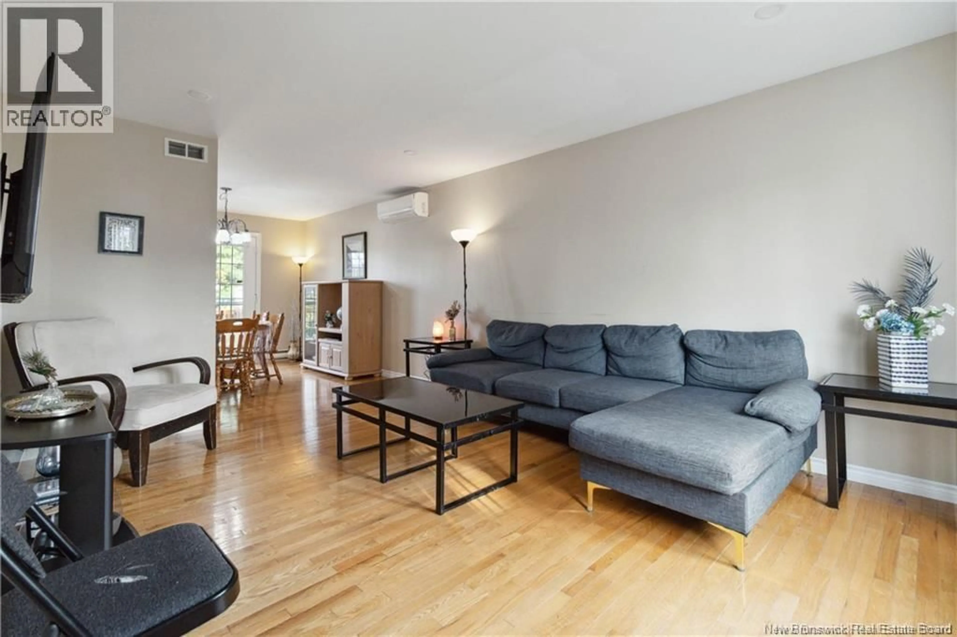 Living room with furniture, wood/laminate floor for 26 ARTHUR STREET, Moncton New Brunswick E1C0A5