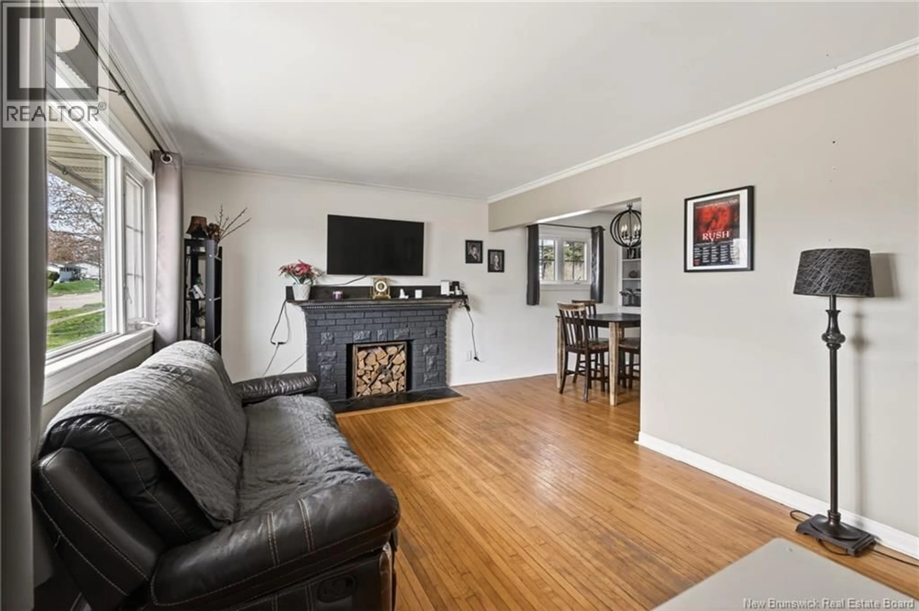 Living room with furniture, wood/laminate floor for 15 BISSETT AVENUE, Moncton New Brunswick E1E2S8