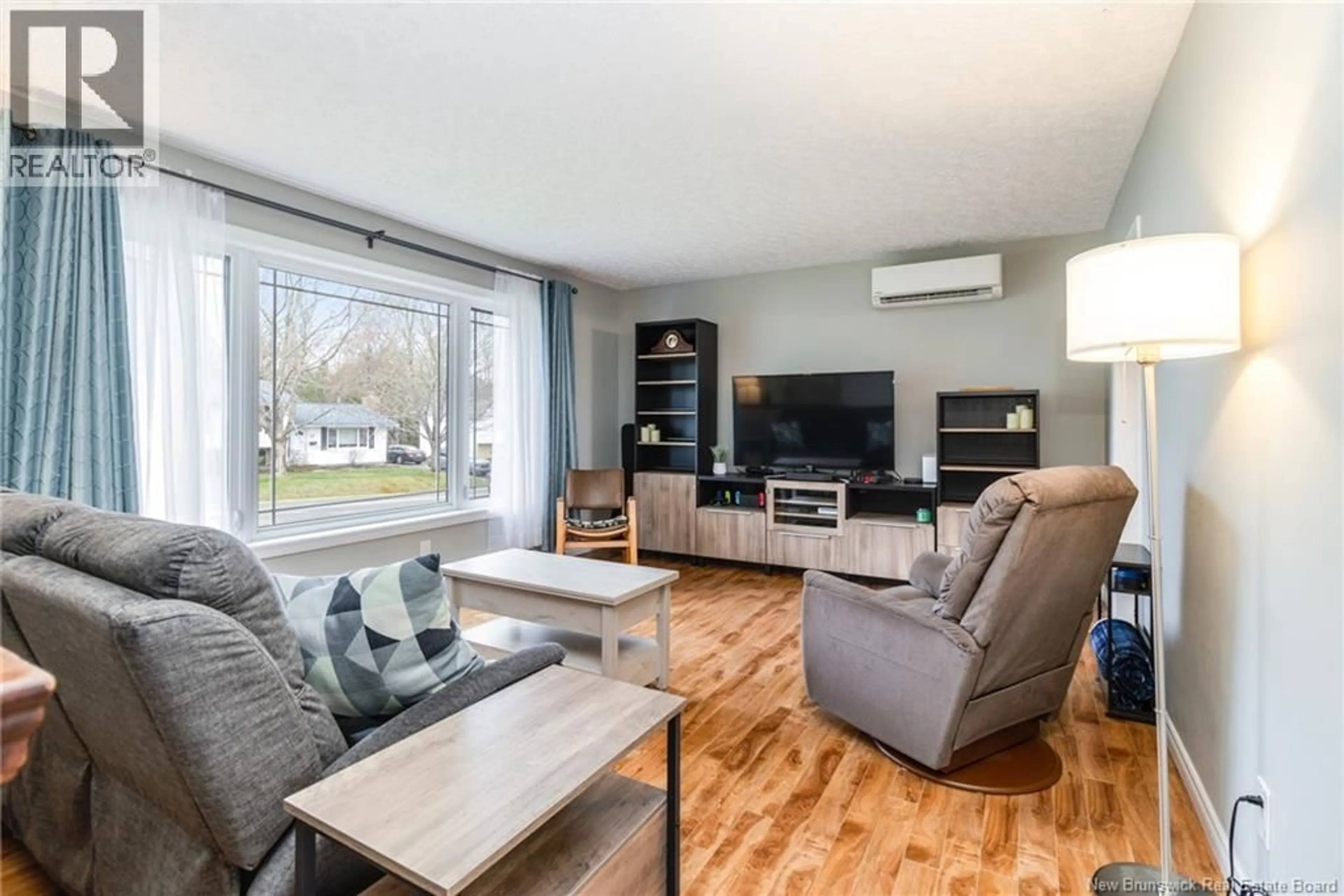 Living room with furniture, wood/laminate floor for 24 BRADLEY AVE, New Maryland New Brunswick E3C1C4