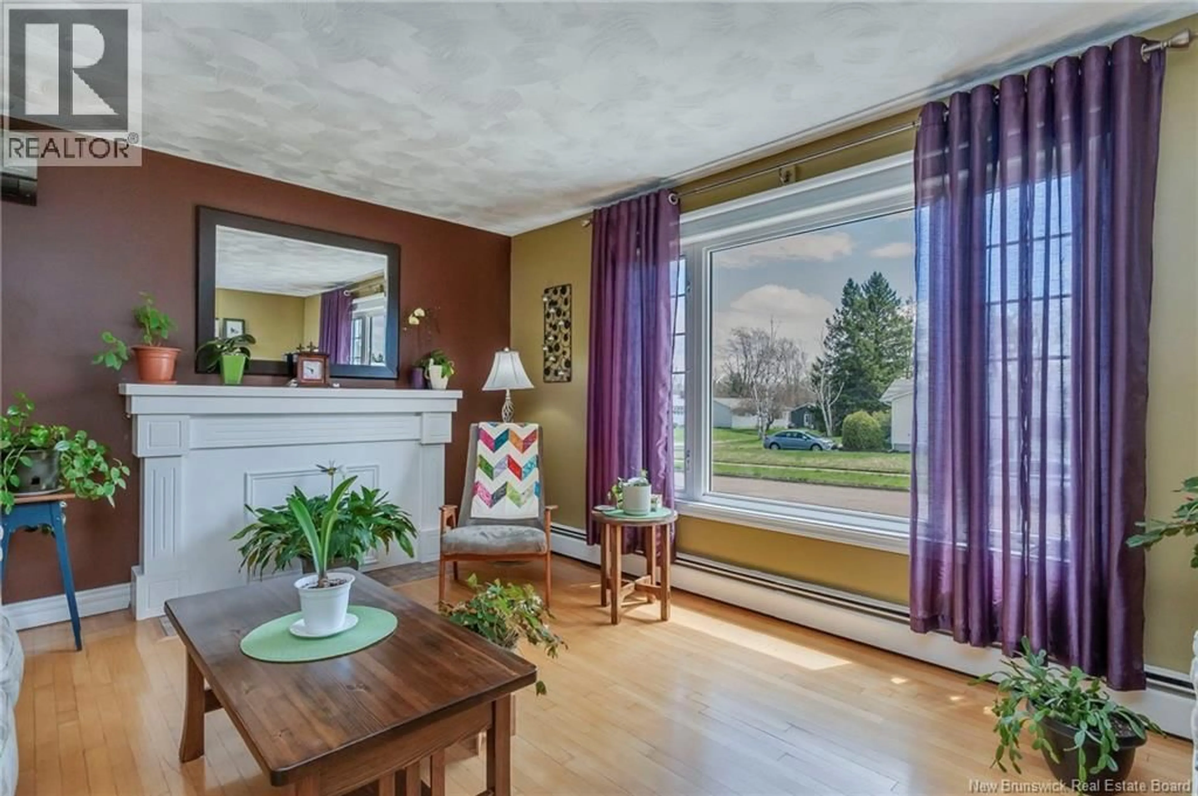 Living room with furniture, wood/laminate floor for 162 QUEEN MARY ROAD, Moncton New Brunswick E1A3P5