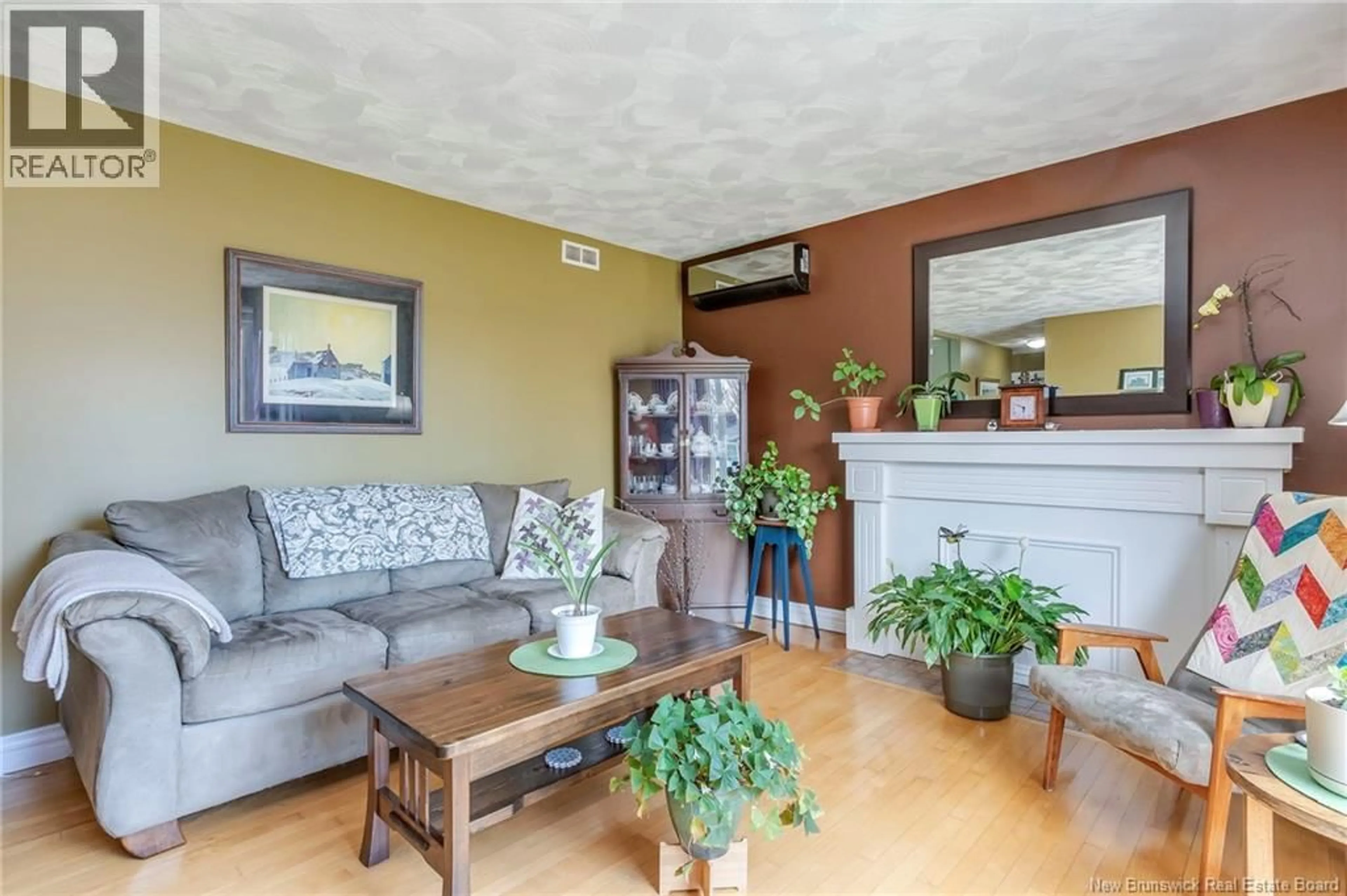 Living room with furniture, wood/laminate floor for 162 QUEEN MARY ROAD, Moncton New Brunswick E1A3P5