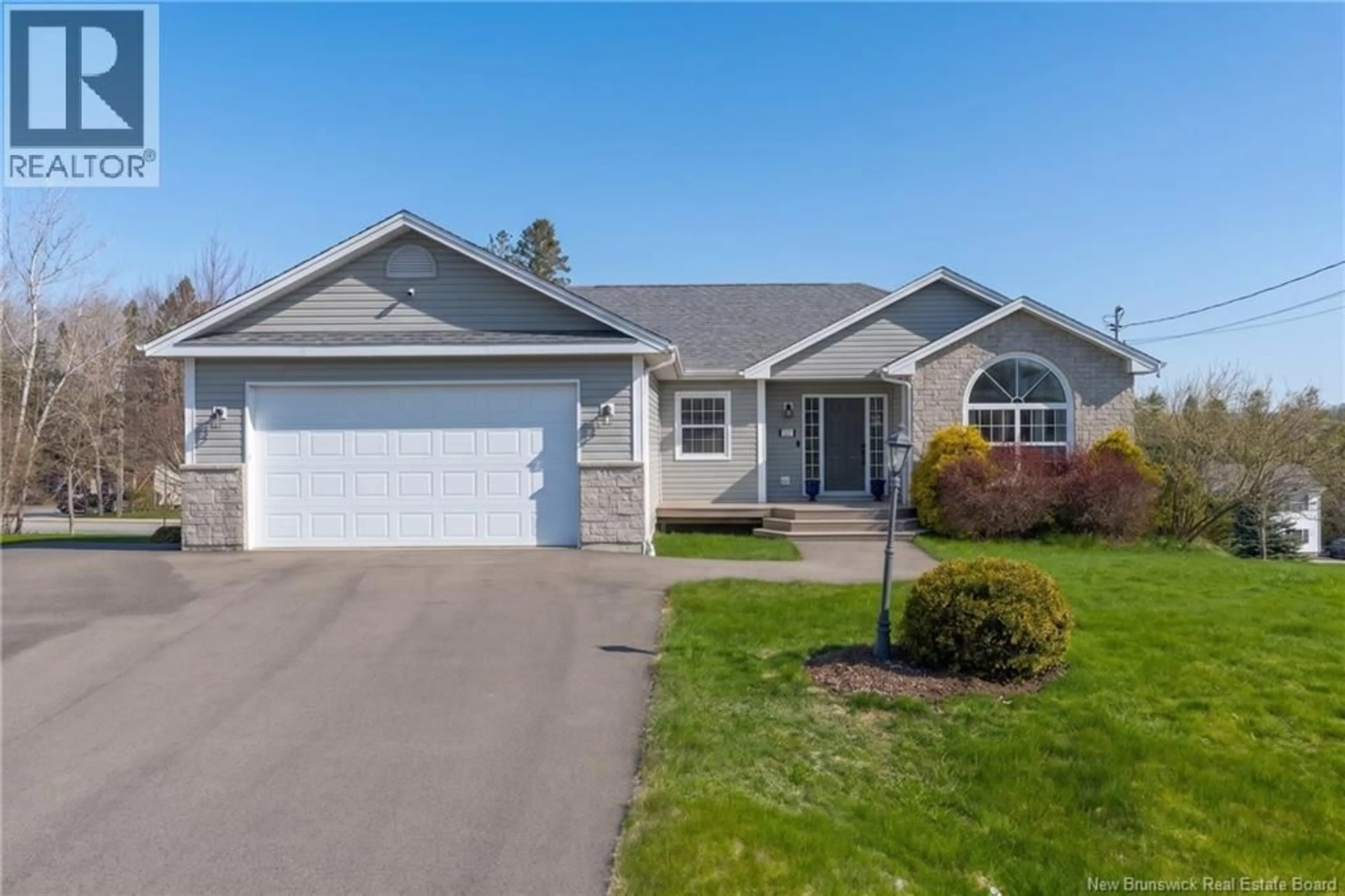 Home with vinyl exterior material, street for 11 TRILLIUM DRIVE, Quispamsis New Brunswick E2E0K9