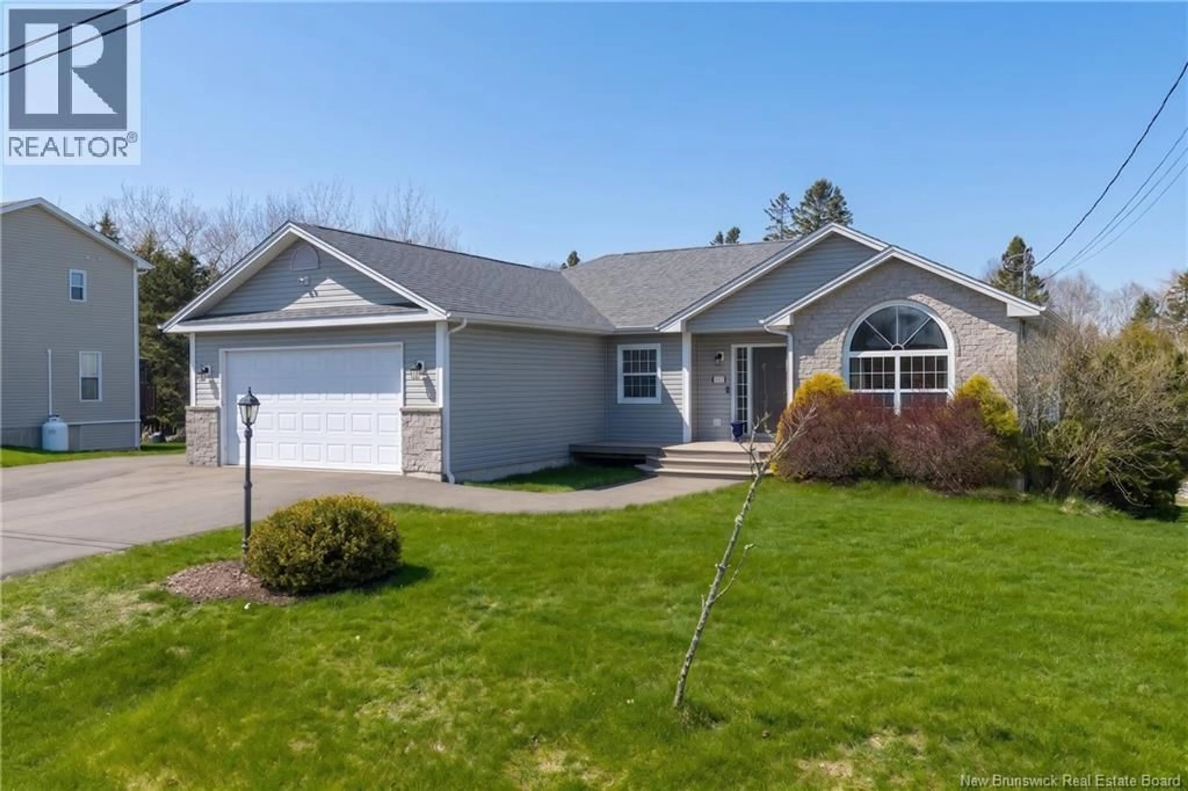 Home with vinyl exterior material, street for 11 TRILLIUM DRIVE, Quispamsis New Brunswick E2E0K9