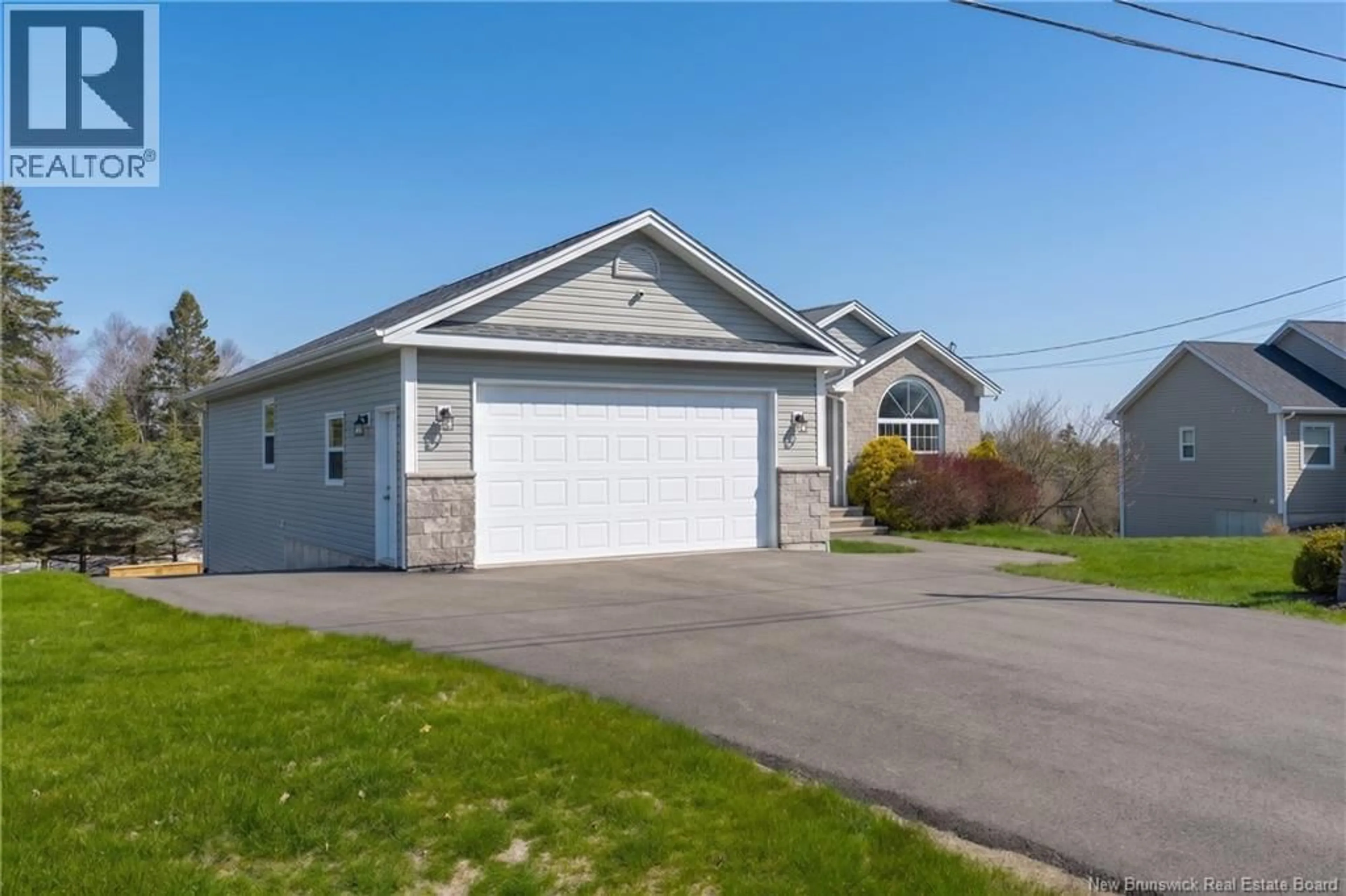 Home with vinyl exterior material, street for 11 TRILLIUM DRIVE, Quispamsis New Brunswick E2E0K9