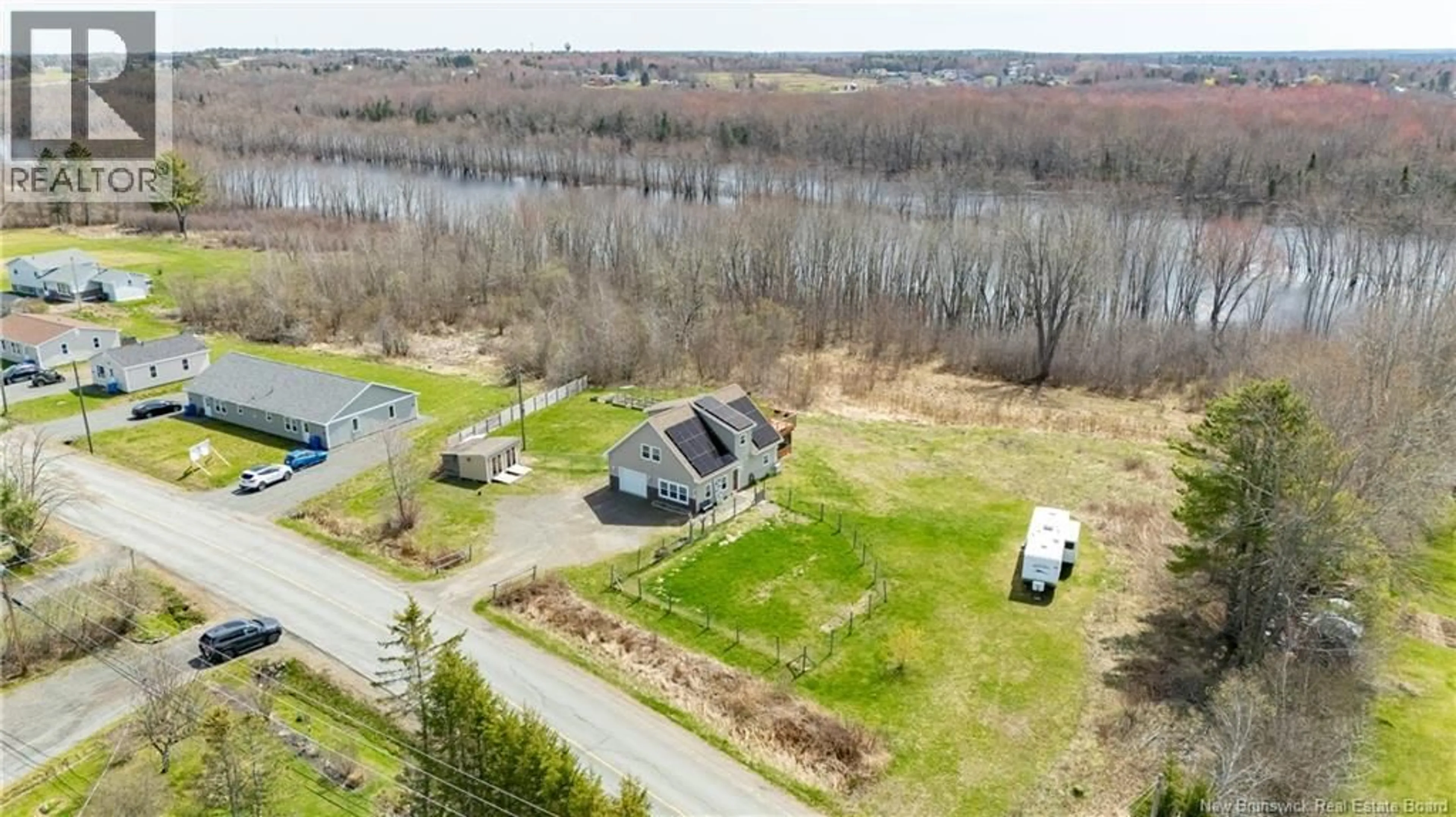 A pic from outside/outdoor area/front of a property/back of a property/a pic from drone, water/lake/river/ocean view for 671 ROUTE 655, Waasis New Brunswick E3B8T6