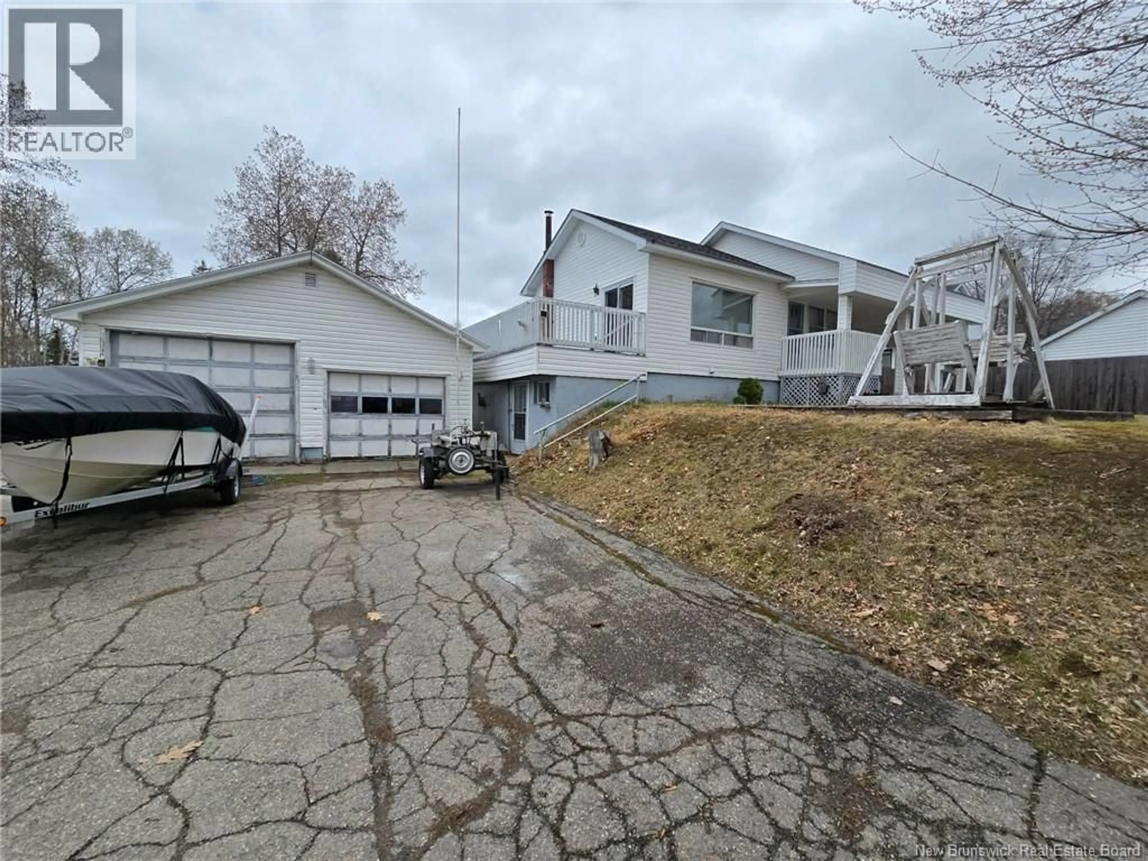 A pic from outside/outdoor area/front of a property/back of a property/a pic from drone, street for 1443 BRIDGE, Bathurst New Brunswick E2A4A5