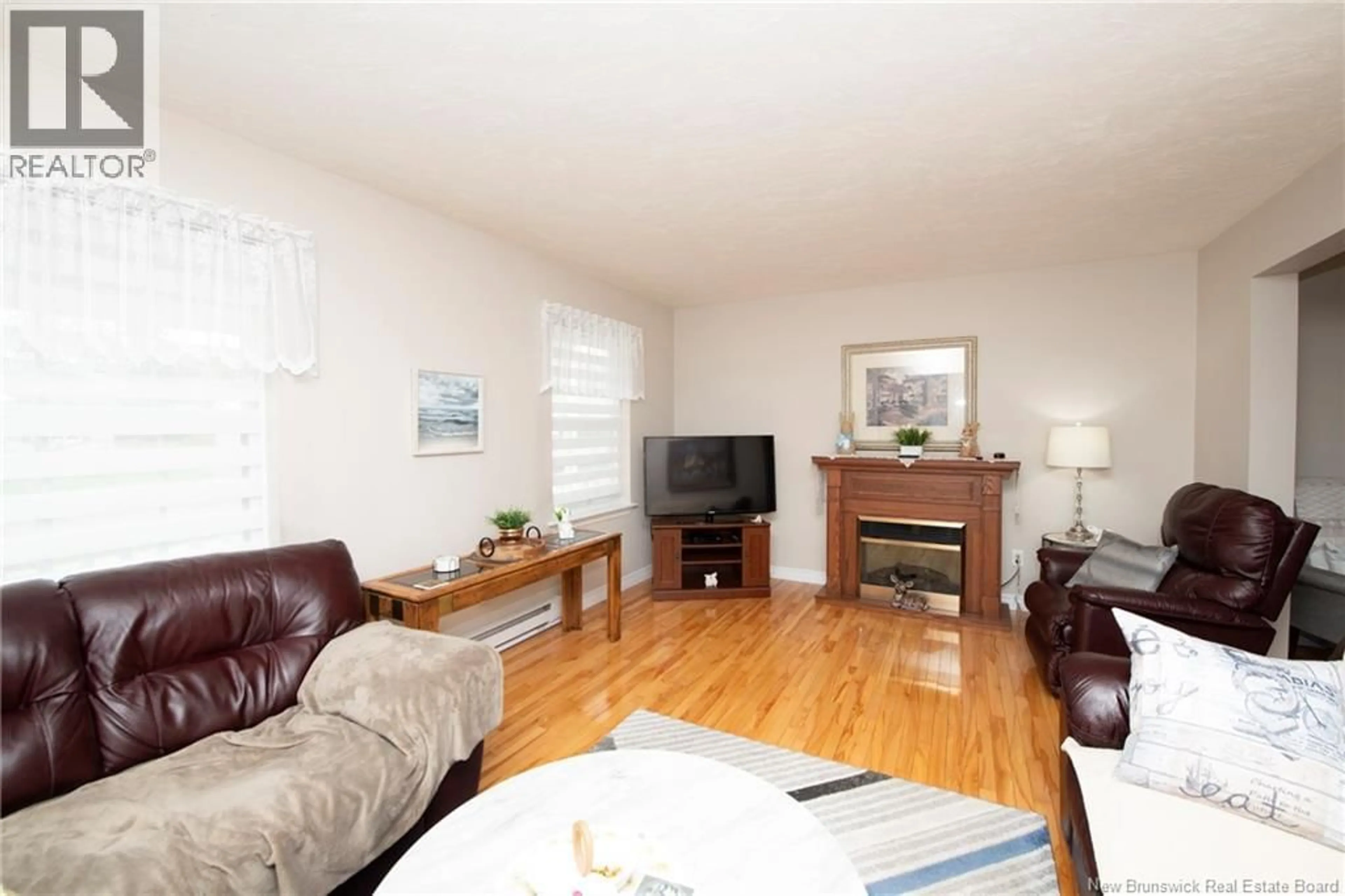 Living room with furniture, wood/laminate floor for 313 WORTHINGTON AVENUE, Moncton New Brunswick E1C0B7