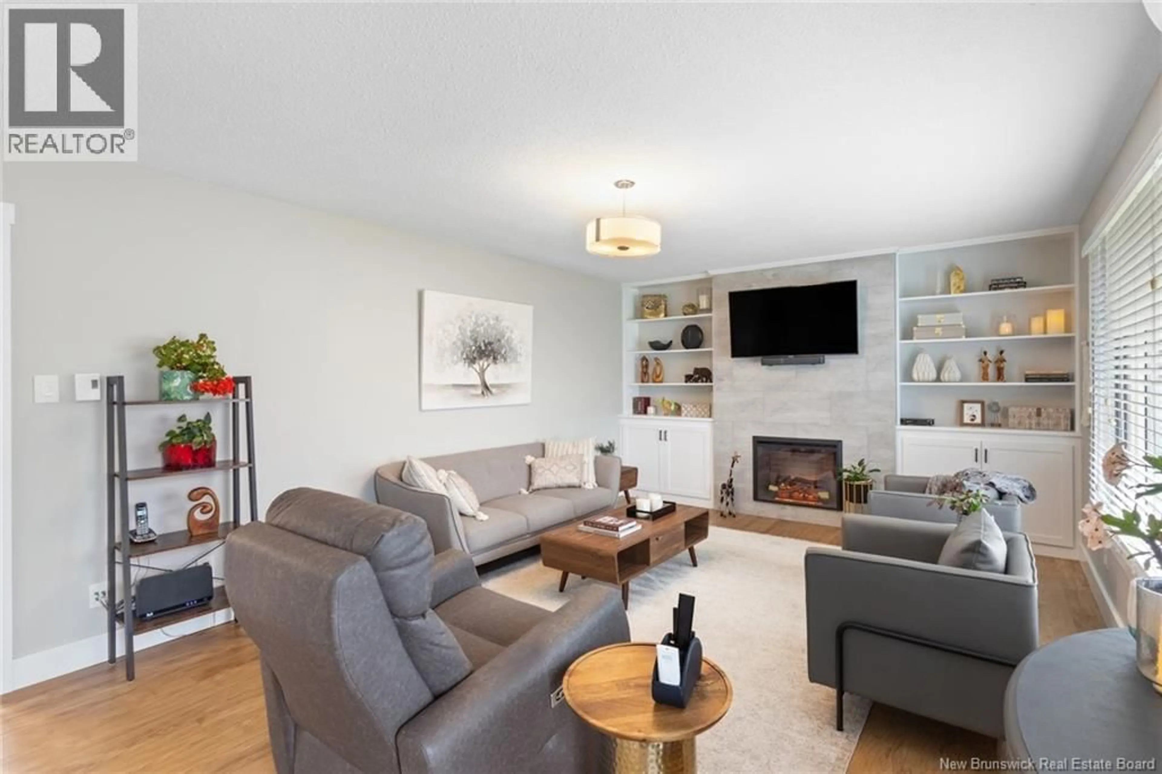 Living room with furniture, wood/laminate floor for 305 MAPLE STREET, Fredericton New Brunswick E3A3R3