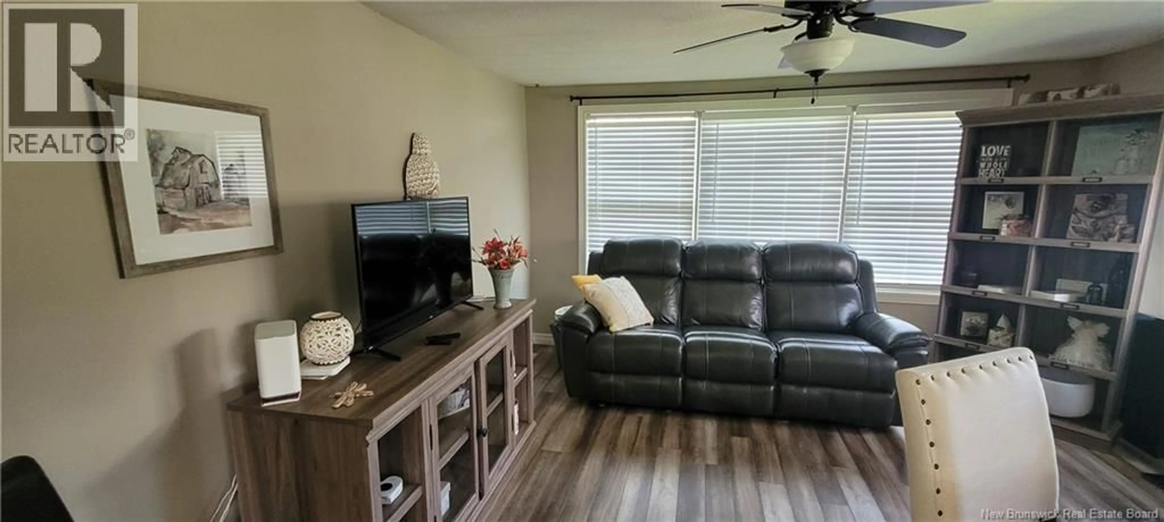 Living room with furniture, wood/laminate floor for 105 PARKER ROAD, Scoudouc New Brunswick E4P3P6