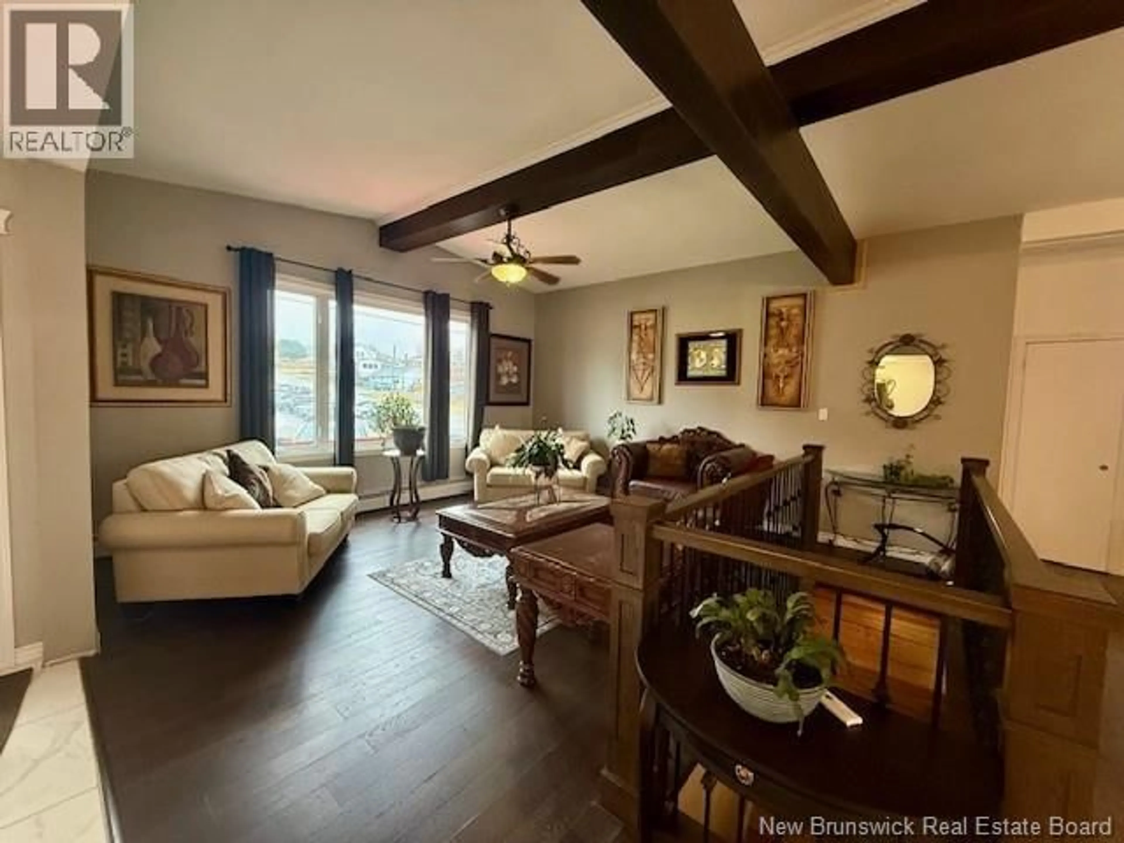 Living room with furniture, wood/laminate floor for 59 ARRAN STREET, Campbellton New Brunswick E3N1T9
